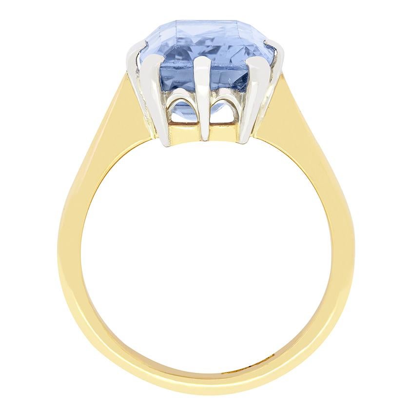 A mesmerising cornflower blue sapphire sits central in this stunning Edwardian solitaire ring. The natural Sapphire weighs an impressive 10.20 carat cut in an elongated cushion cut. Set within a platinum collet the sapphires beauty is standout. A
