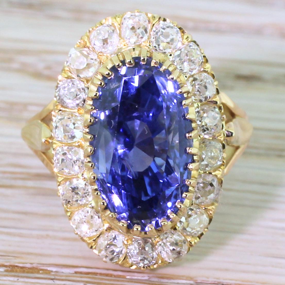 The most perfect blue. This glowing cornflower Ceylon sapphire – natural, unheated – is claw-set above a surround of eighteen high white and bright old cut diamonds. The finely hand-pierced gallery leads to a split shoulder shank with an over-sized