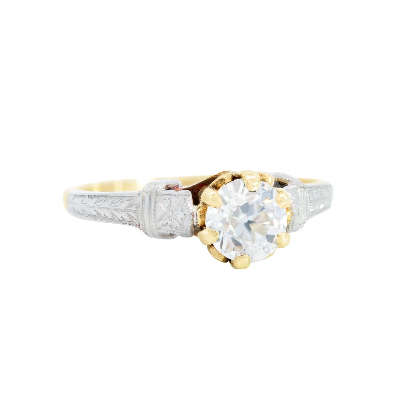 A lovely diamond ring from the Edwardian (ca1900) era! Beautiful in its simplicity, this solitaire-style ring is crafted in 10k yellow and white gold. At the center is an approximately 0.59ct diamond, which rests in a yellow gold 6-prong setting.