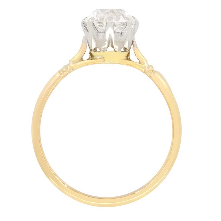 This classic Edwardian solitaire features a glittering 1.10 carat, old cut diamond at it’s centre. The diamond has good quality at G in colour and SI in clarity. Claw set into a platinum collet the diamond simply shines. A split shoulder band of 18