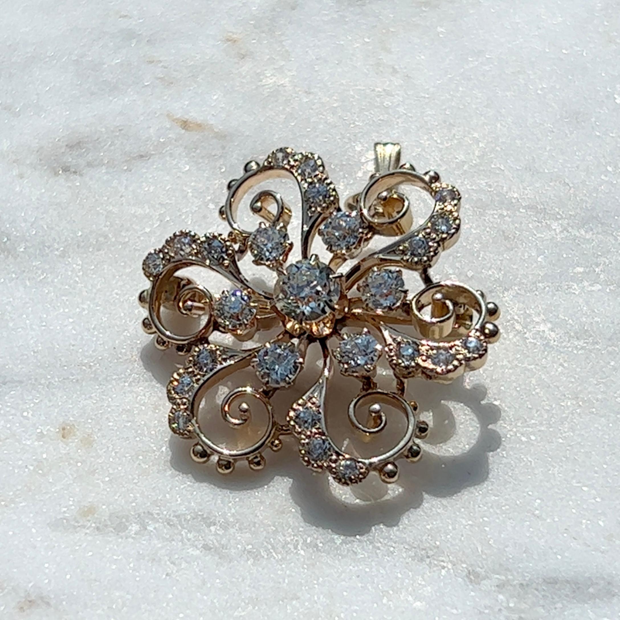 One 14 karat yellow gold Edwardian cluster pin/pendant set with twenty-five (25) old European cut diamonds, approximately 1.15 carats total weight with matching J/K color and SI1 clarity.  The pin measures one inch and is complete with traditional