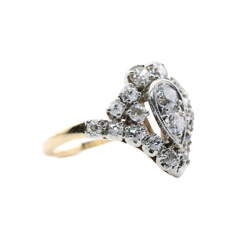 Aston Estate Jewelry Presents:

An Edwardian period diamond cocktail ring by Jabel. Set with 1.16 carats of old mine cut diamonds in platinum, atop 14 karat yellow gold. Grading as G to I color, and VS to SI clarity, the well matched old mine cuts