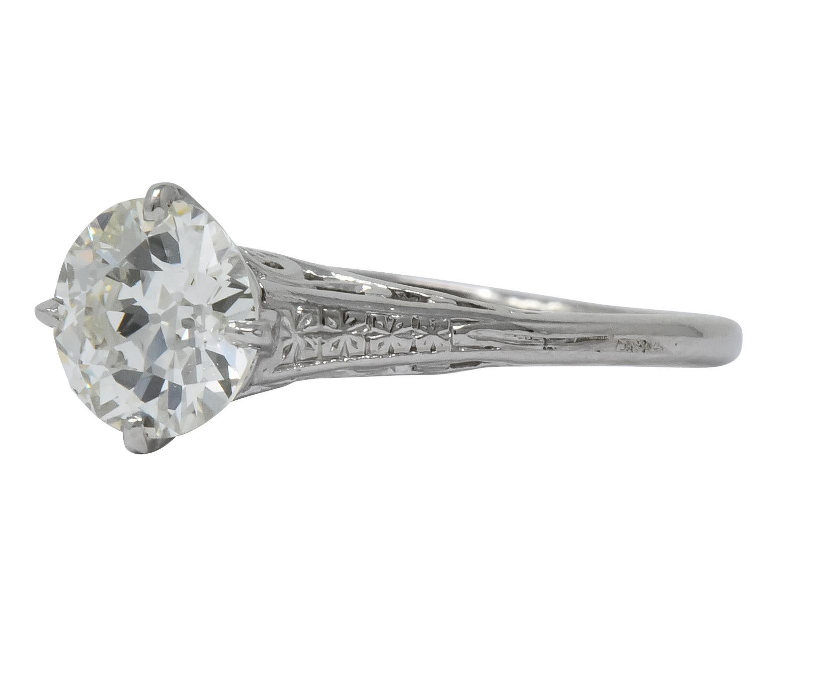 Centering an old European cut diamond weighing 1.23 carats, L color and VS1 clarity

With a delicate pierced platinum and floral engraved gallery, with a north, east south, west setting 

Tested as platinum

Ring Size: 7 & Sizable

Top measures 7.8