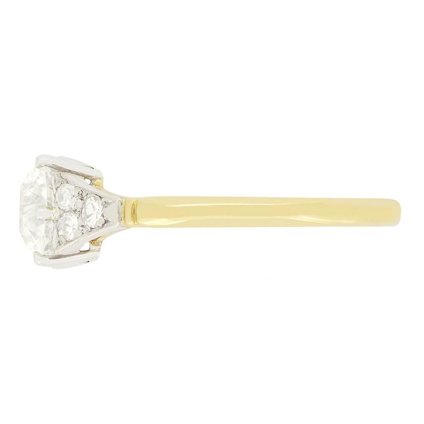 Centring around a stunning old oval cut diamond, this solitaire dates to the Edwardian period. The 1.30 carat stone has a colour of H and clarity of VS1. Set into a wonderfully carved platinum collet featuring heart motifs, the diamond is framed