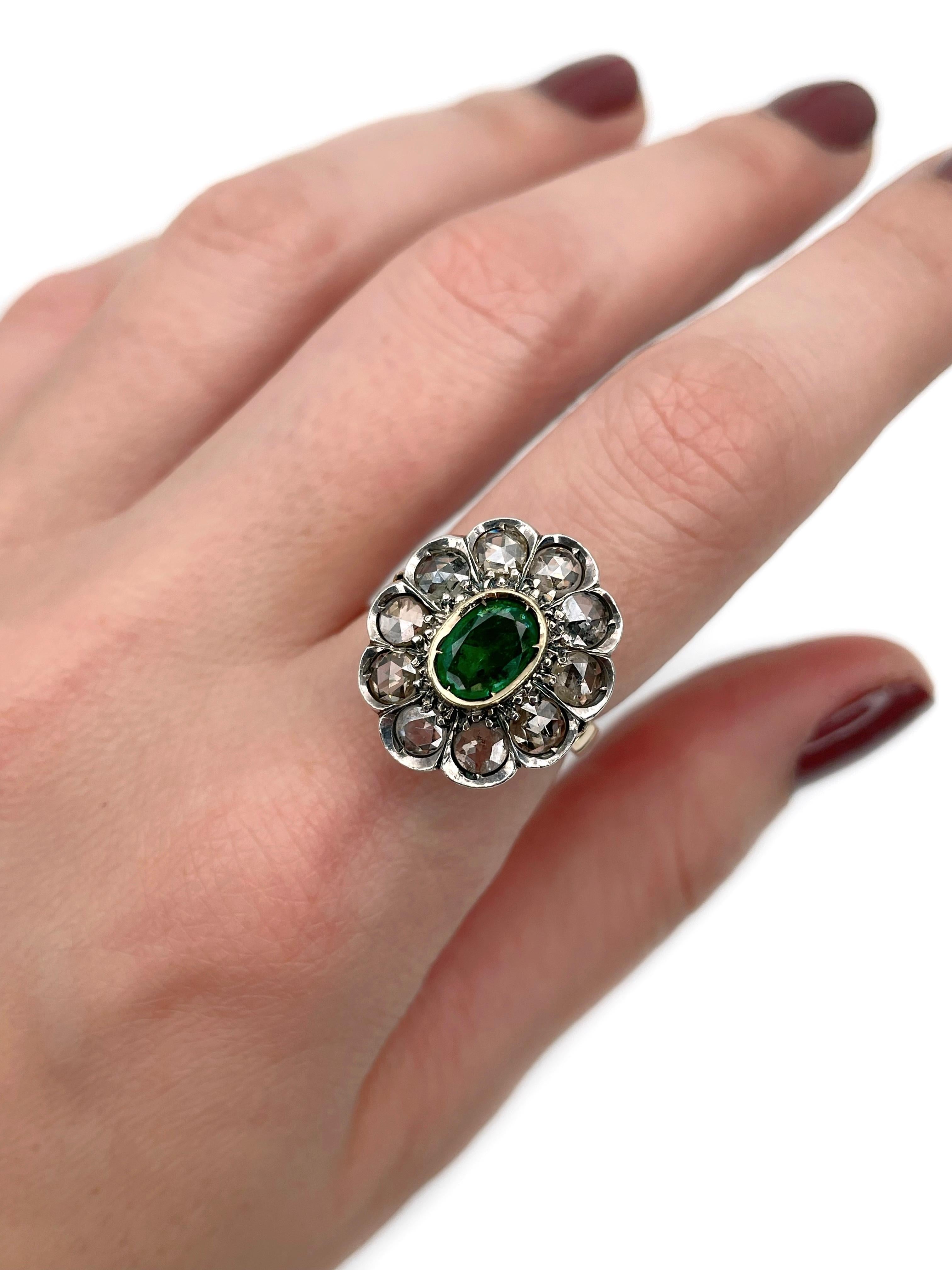 This is an Edwardian cluster ring crafted in 14K gold and 925 silver. Circa 1910. 

The piece features:
- 1 emerald, oval cut, 0.85ct, vslbG 6/4, P1
- 10 diamonds, rose cut, TW 1.50ct, TW-T, SI-P1

Weight: 6.97g
Size: 17 (US 6.5)

IMPORTANT: please