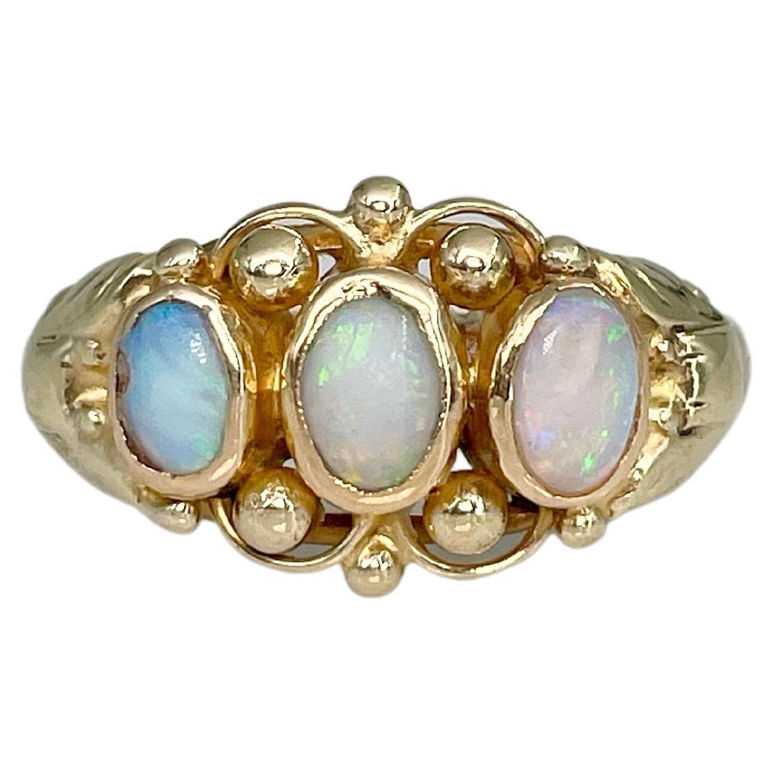 Edwardian 14 Karat Yellow Gold Cabochon Cut Opal Three Stone Band Ring