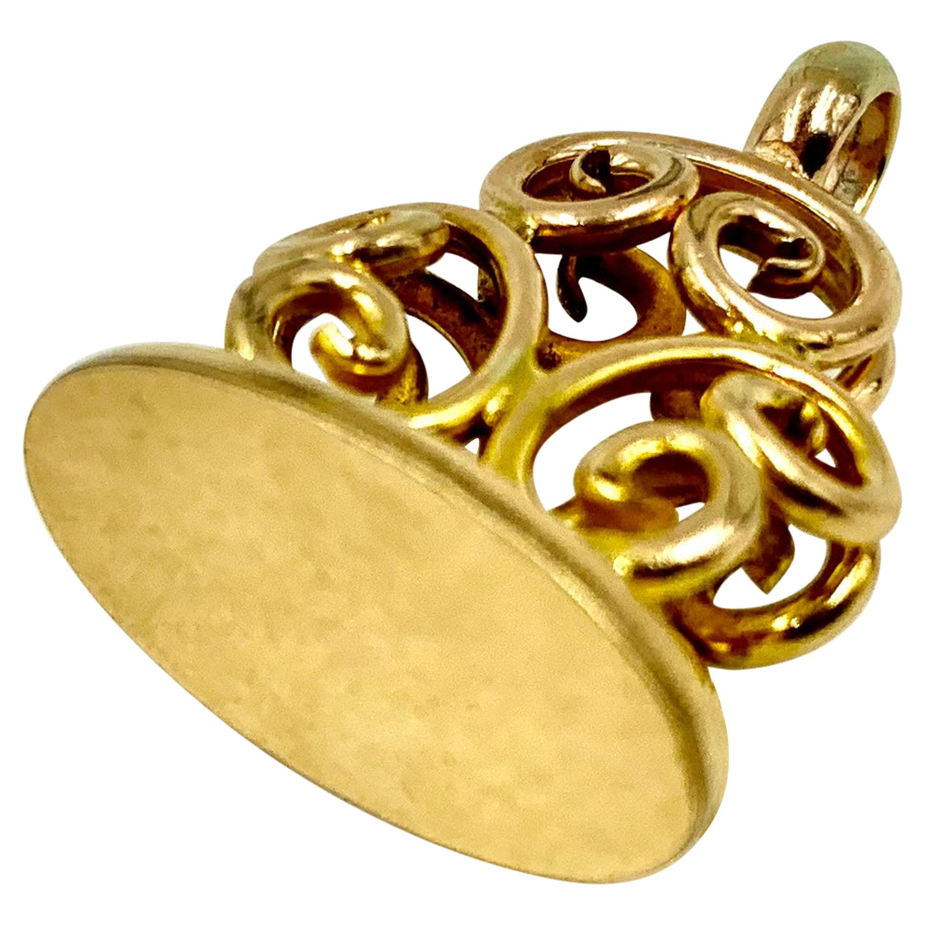 Beautiful antique Edwardian 14K yellow gold scroll motif signet seal pendant, wonderful for personalization. 
Each side composed of three connected C scrolls with an elegant oval seal platform, topped with a generous oval bail. 
Late 19th