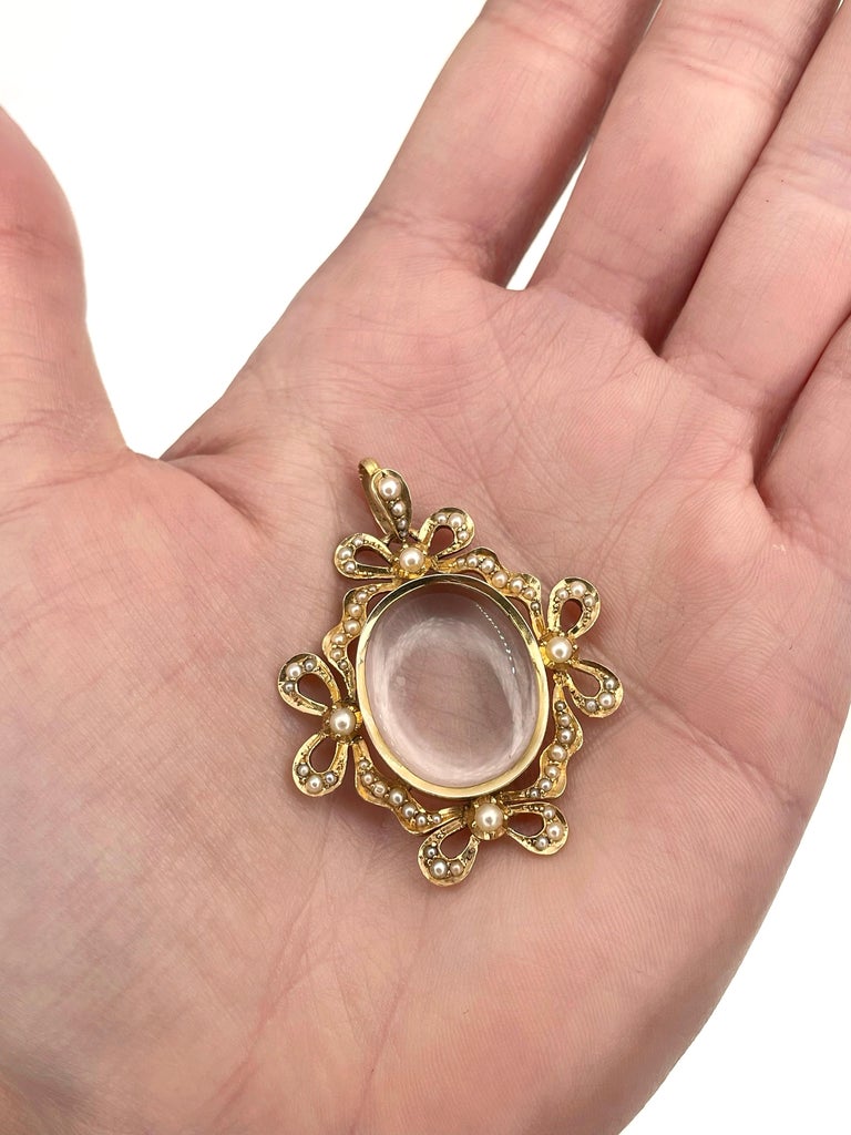 Edwardian 14 Karat Yellow Gold Seed Pearl Bow Clear Locket Pendant For
