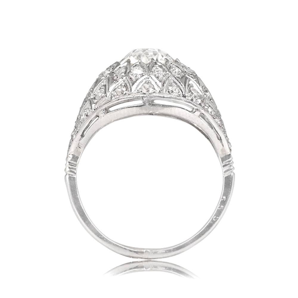 This antique Edwardian ring, handcrafted in platinum circa 1900, showcases a beautiful 1.48 carat old European cut diamond with K color and VS2 clarity. The diamond is set in a dome filigree setting, surrounded by pave-set single-cut diamonds and