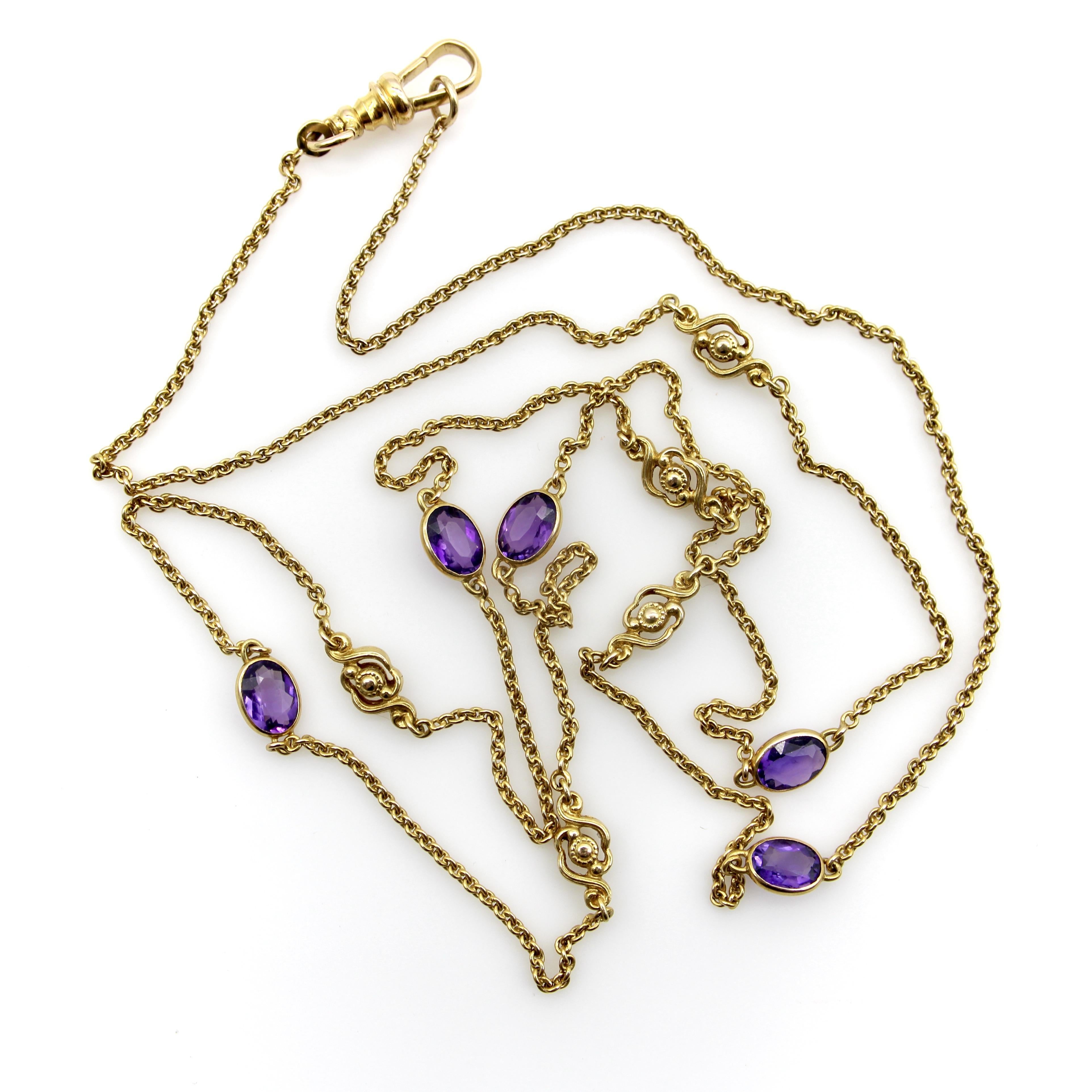 This 14k gold Edwardian chain has five amethyst stations that alternate between five floral station elements. The amethysts are a saturated purple with hints of red, bezel set and add a great pop of color throughout the chain. The floral elements