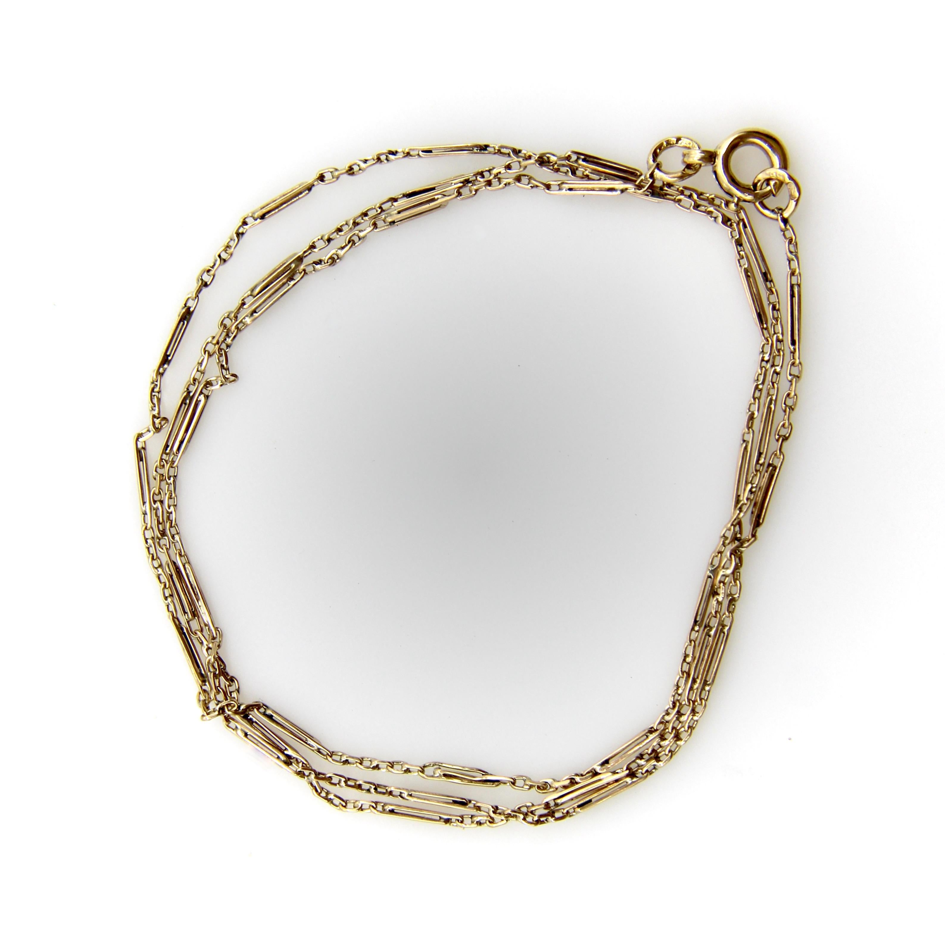 We love when we come across handmade chains; this one is ultra delicate and circa the Edwardian era. The chain consists of tiny gold bars that create a station. Between each station are a series of links that create a different station. The piece is