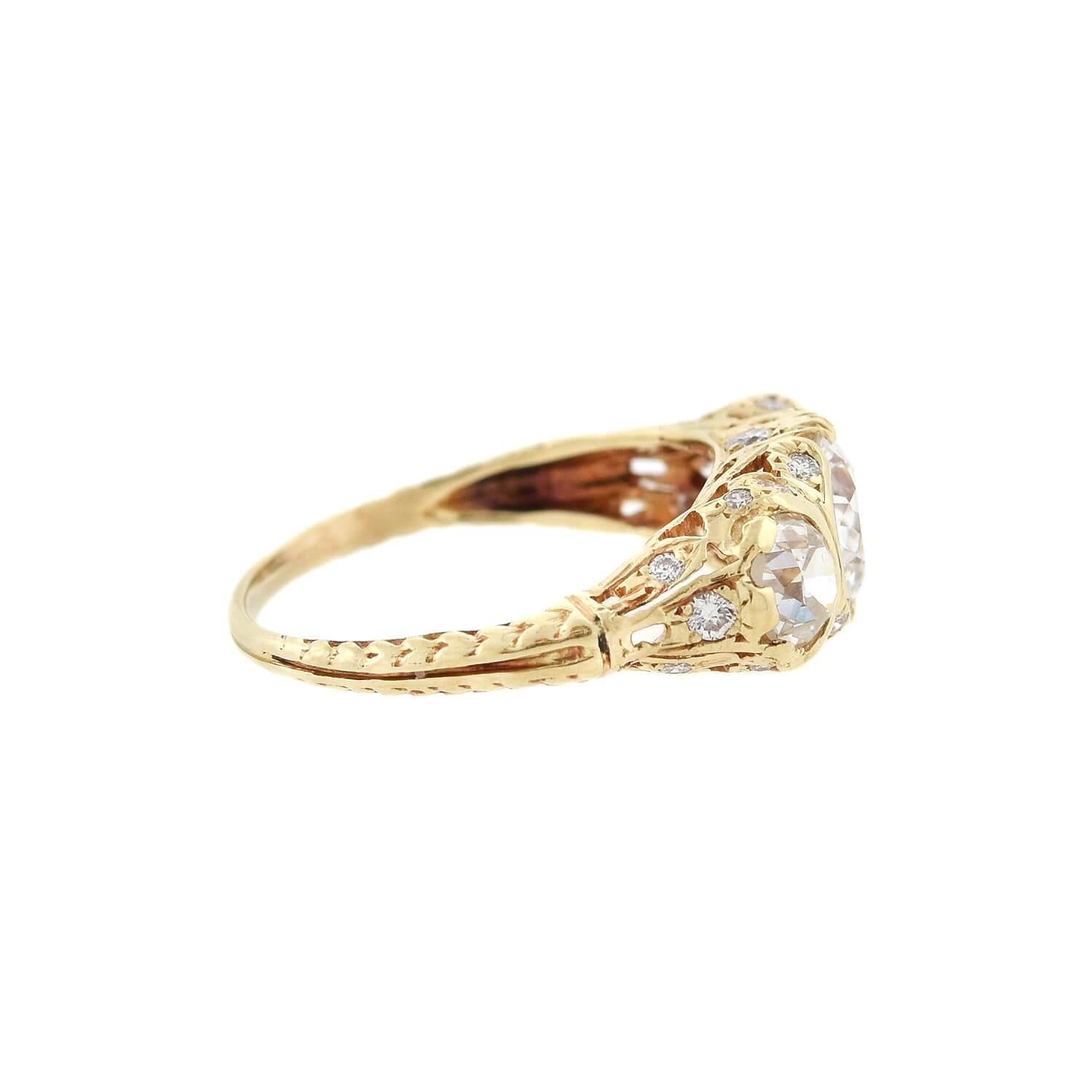 An incredible ring from the Edwardian (ca1910s) era! Crafted in 14kt yellow gold, this ring adorns three gorgeous Old European Cut diamonds. The central diamond measures approximately 1ctw and the two side diamonds weigh about 0.25ctw each, all in