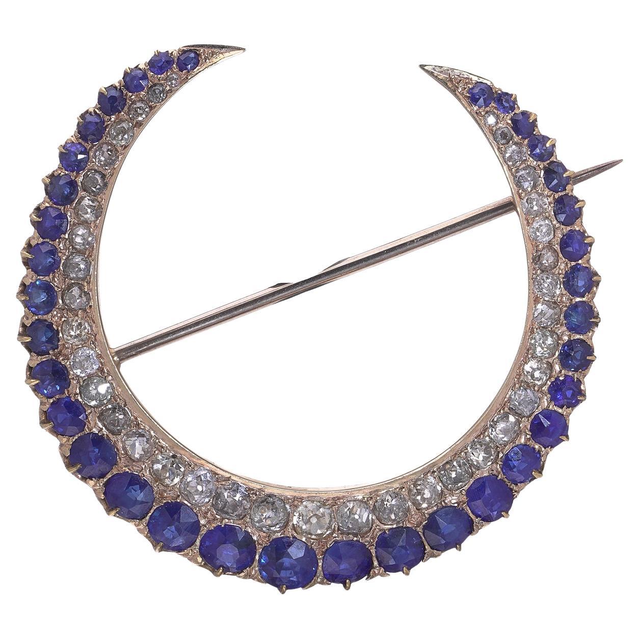 Broche ancienne en or 15kt avec saphir et diamant en forme de croissant