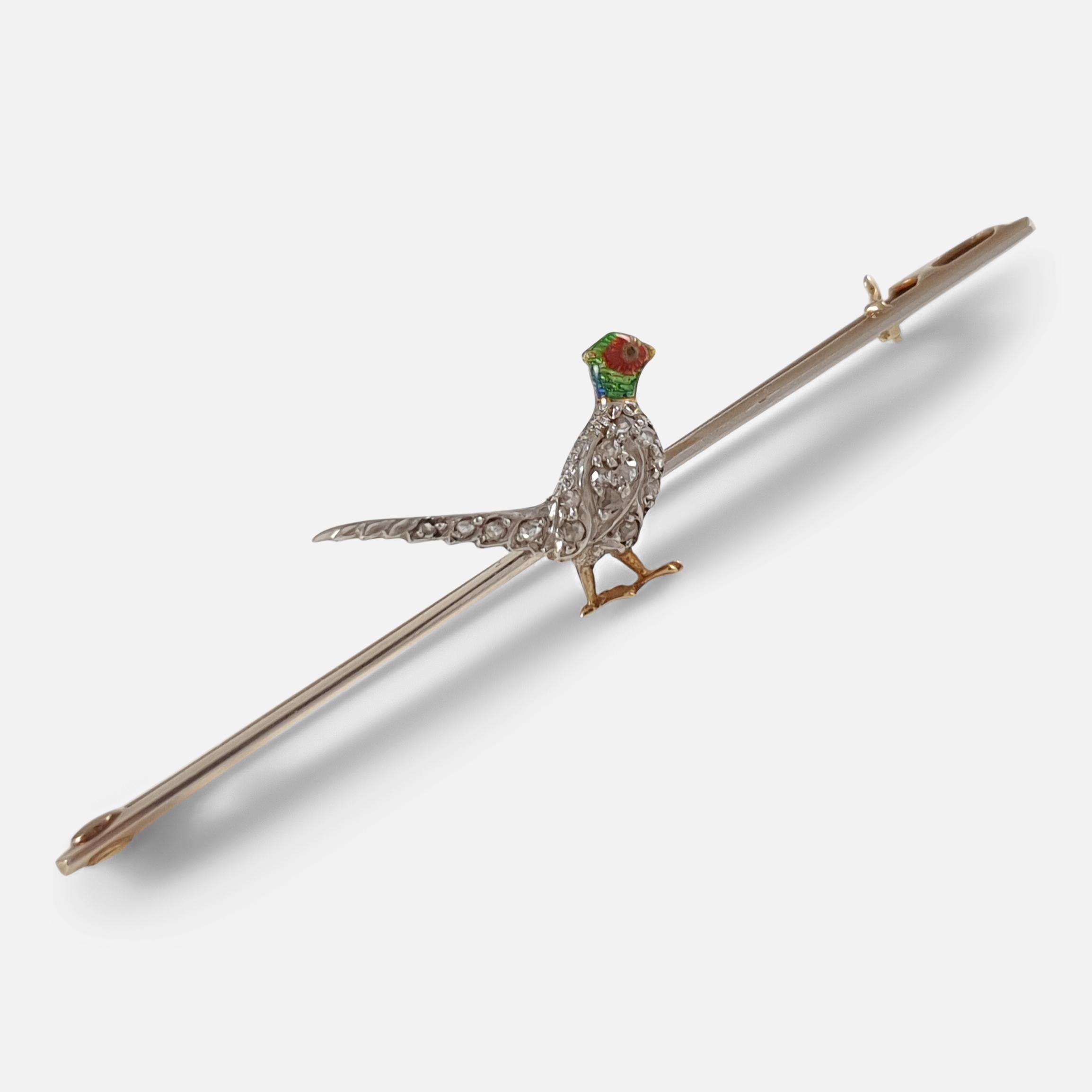 An Edwardian 15 carat yellow gold, platinum fronted, diamond, and enamel pheasant pin brooch. The brooch depicts a pheasant decorated with enameling to its head, and diamonds to its body. 

The brooch is stamped ‘15CT PLATm’ to denote 15 karat