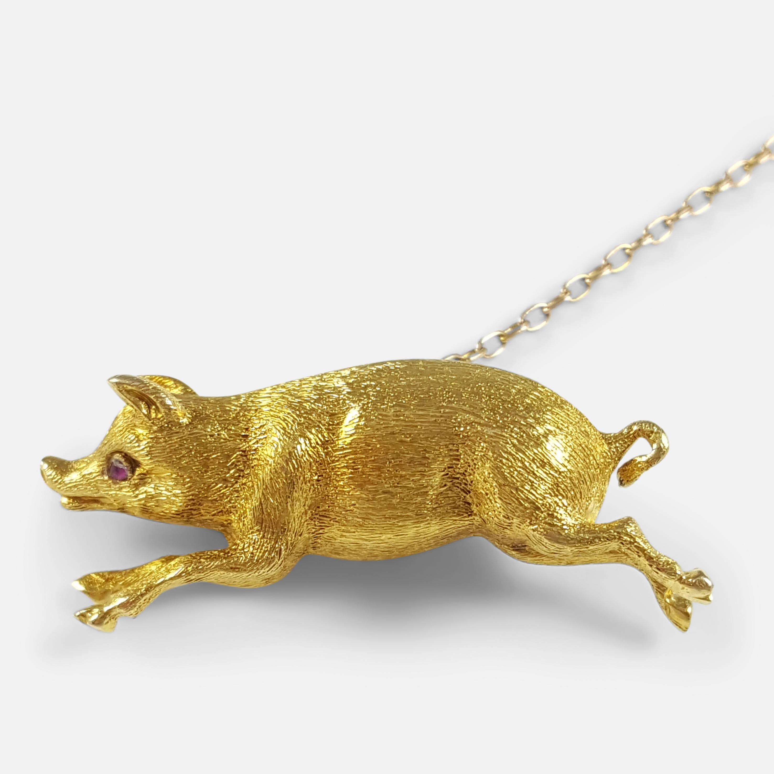 Description: - This is a beautiful, Edwardian 15 karat yellow gold pig brooch. The brooch is crafted in the form of a pig in full flight. The brooch is stamped '15ct' to the body to denote 15 karat (carat) gold. The pig has a ruby eye, which have