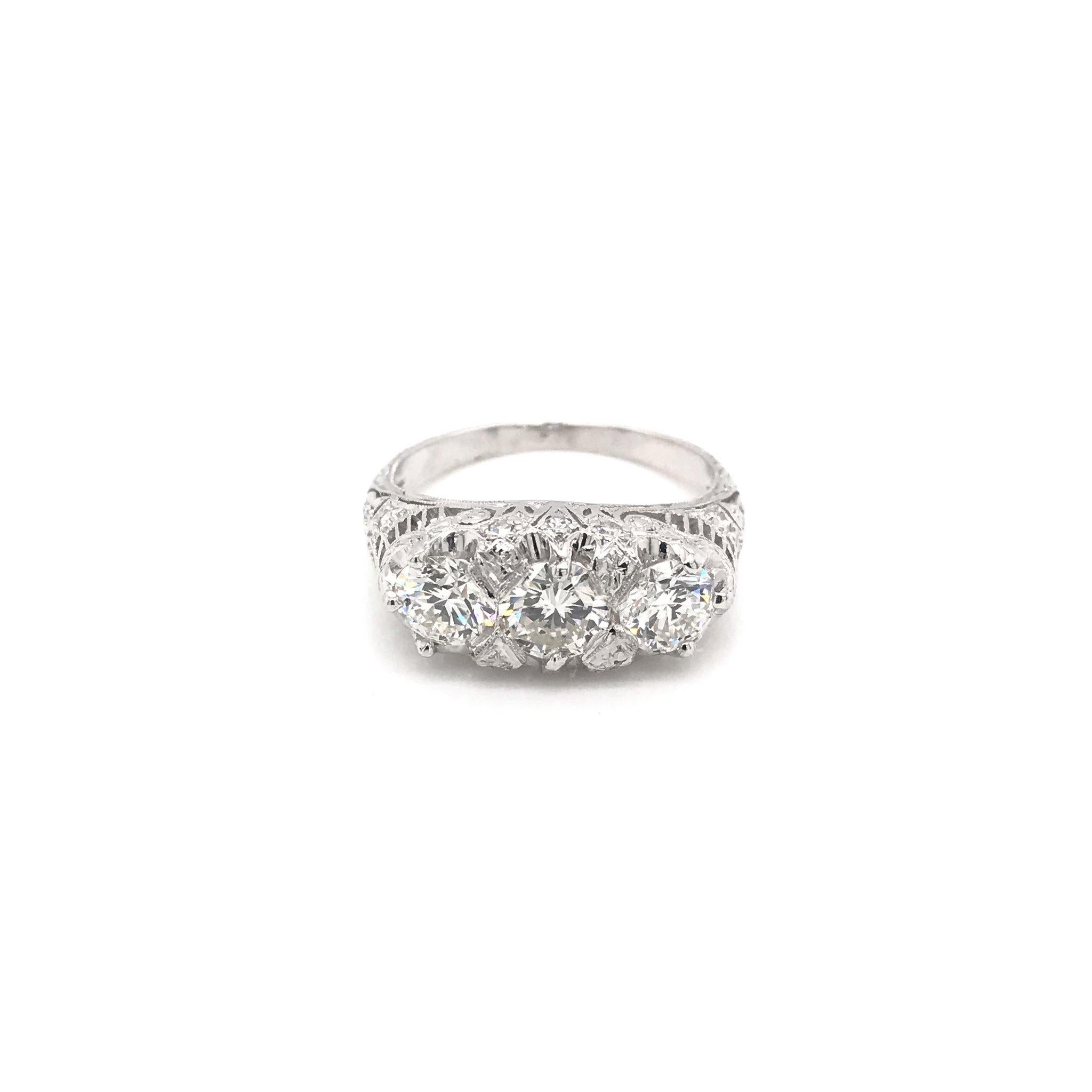 Edwardian 1.55 Carat Three-Stone Diamond Platinum Filigree Engagement Ring In Good Condition In Montgomery, AL