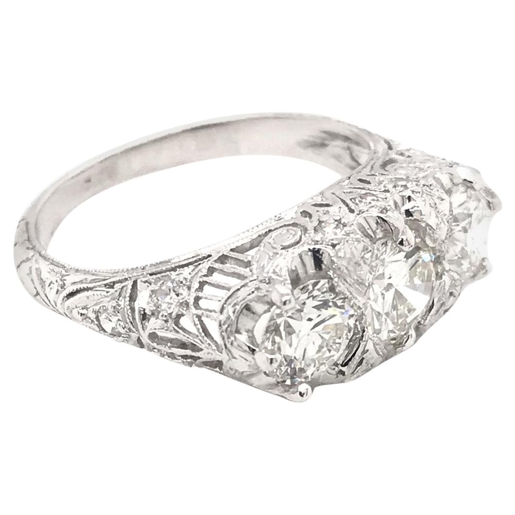 Edwardian 1.55 Carat Three-Stone Diamond Platinum Filigree Engagement Ring