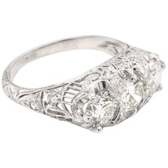 Edwardian 1.55 Carat Three-Stone Diamond Platinum Filigree Engagement Ring