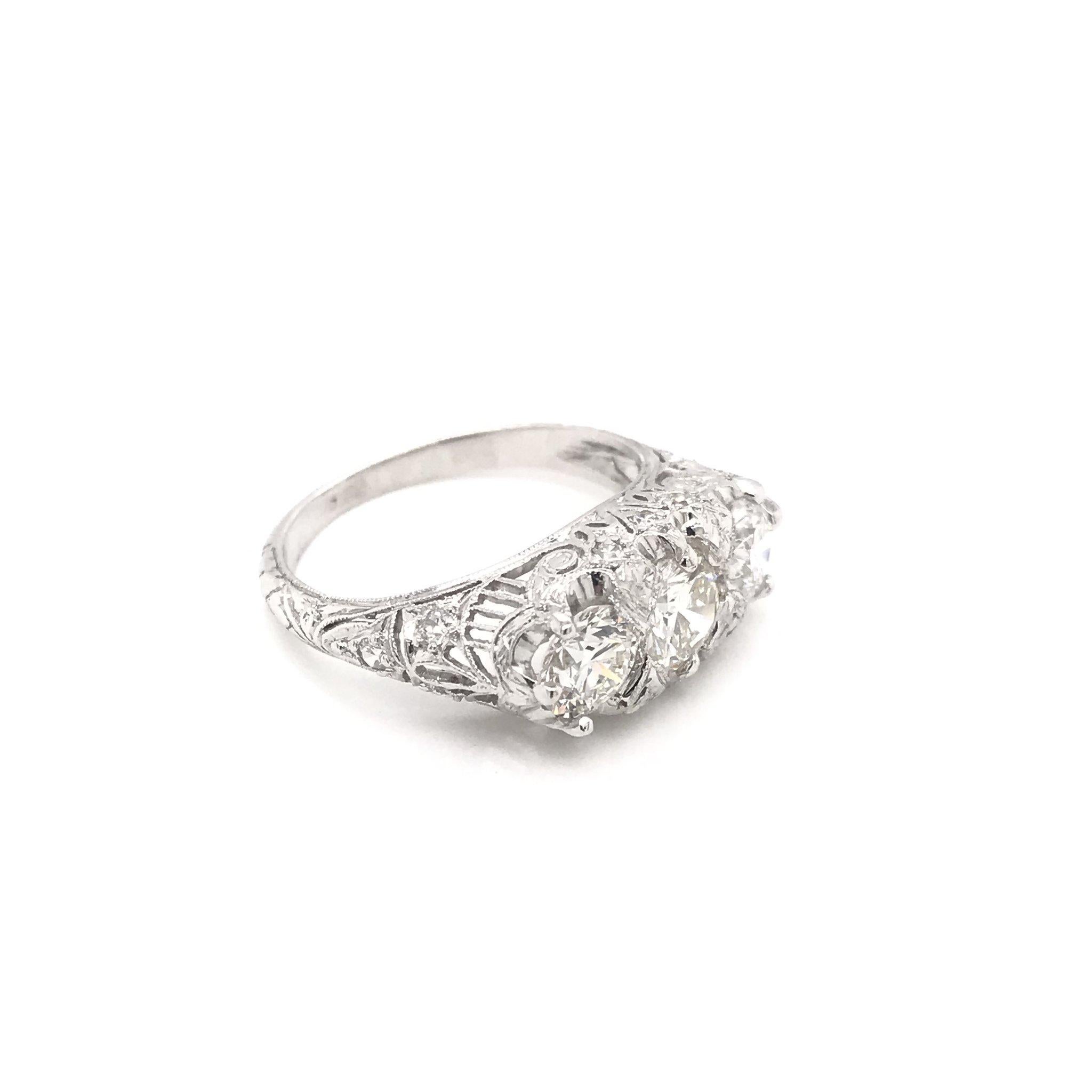 Round Cut Edwardian 1.55 Carat Three-Stone Diamond Platinum Filigree Engagement Ring