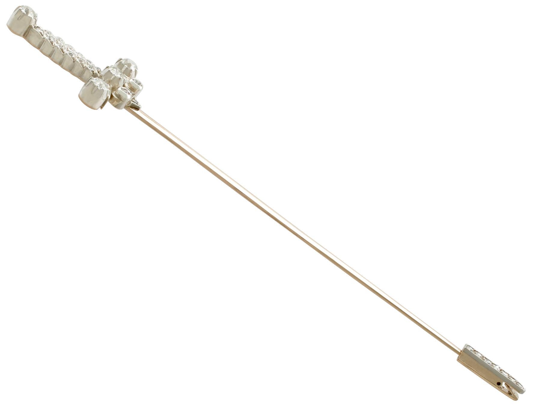 A large, fine and stunning antique Edwardian 1.59 carat diamond and 9k yellow gold, silver set, jabot pin brooch in the form of a sword; part of our diverse diamond jewelry and estate jewelry collections

This large and stunning antique Edwardian