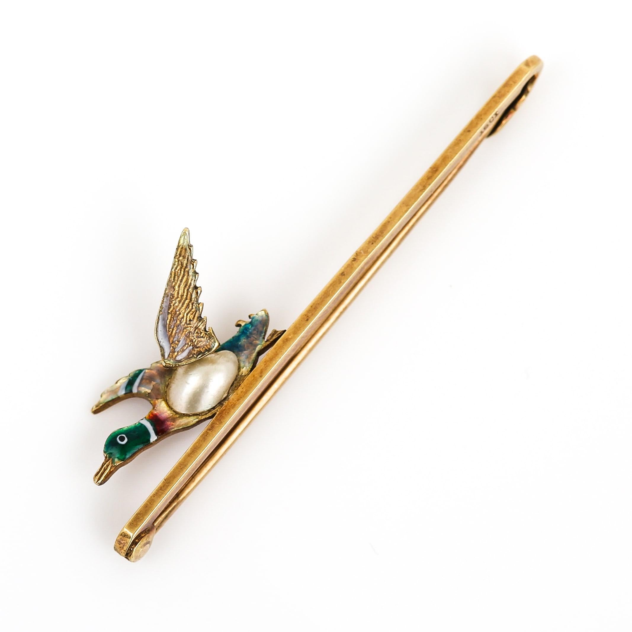 A beautiful Victorian 15ct yellow gold duck bar brooch. The duck is delicately and masterfully enamelled in a variety of colours, this remains mostly intact. The body of the brooch is made from half a Baroque pearl with a creamy lustre. A fantastic