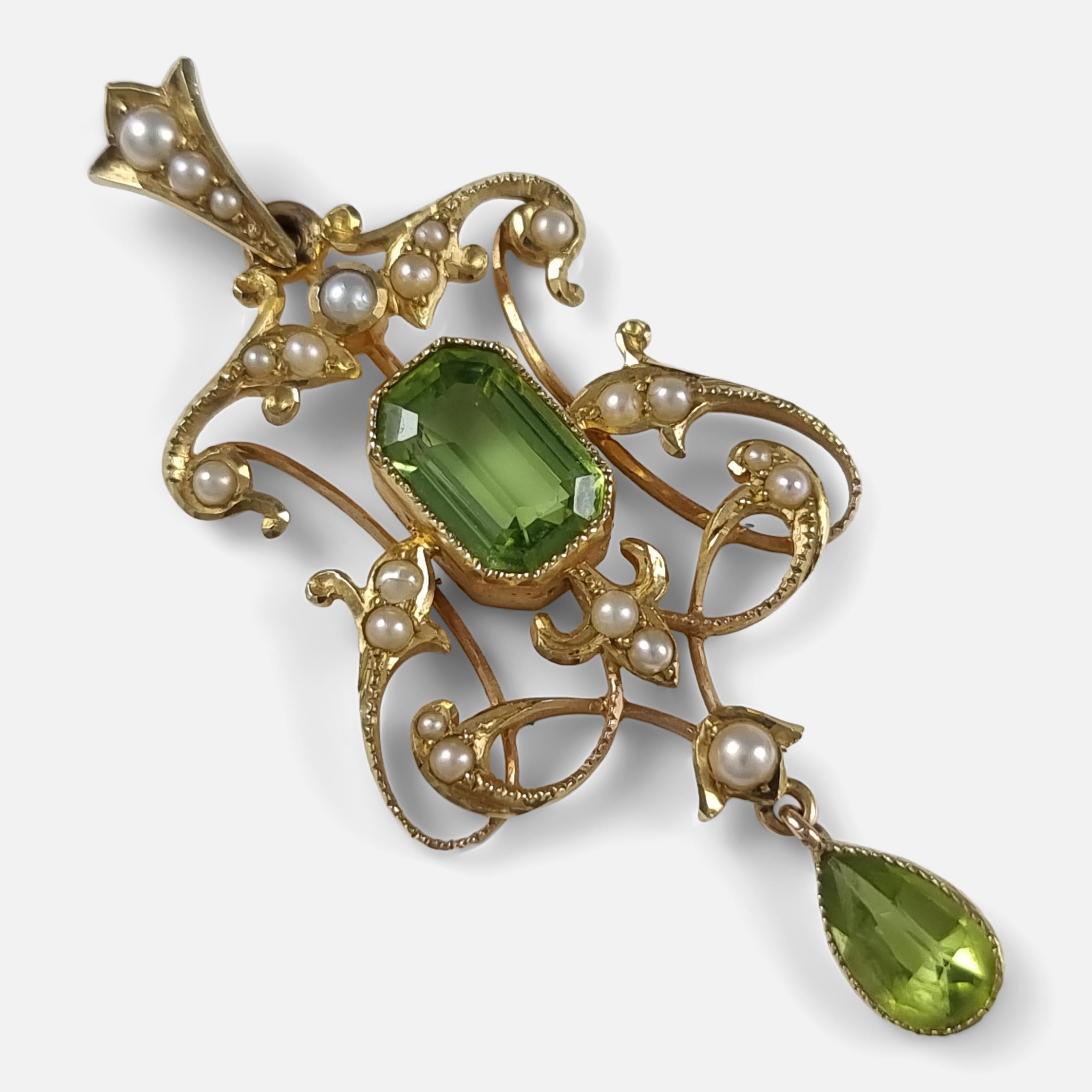 An antique Edwardian period 15ct yellow gold peridot and seed pearl pendant.

As was common for the period, the pendant is stamped '15ct' to denote 15 carat gold fineness.

Date: - Circa 1905.

Measurement: - 4.7cm (height including bale) x 2.2cm