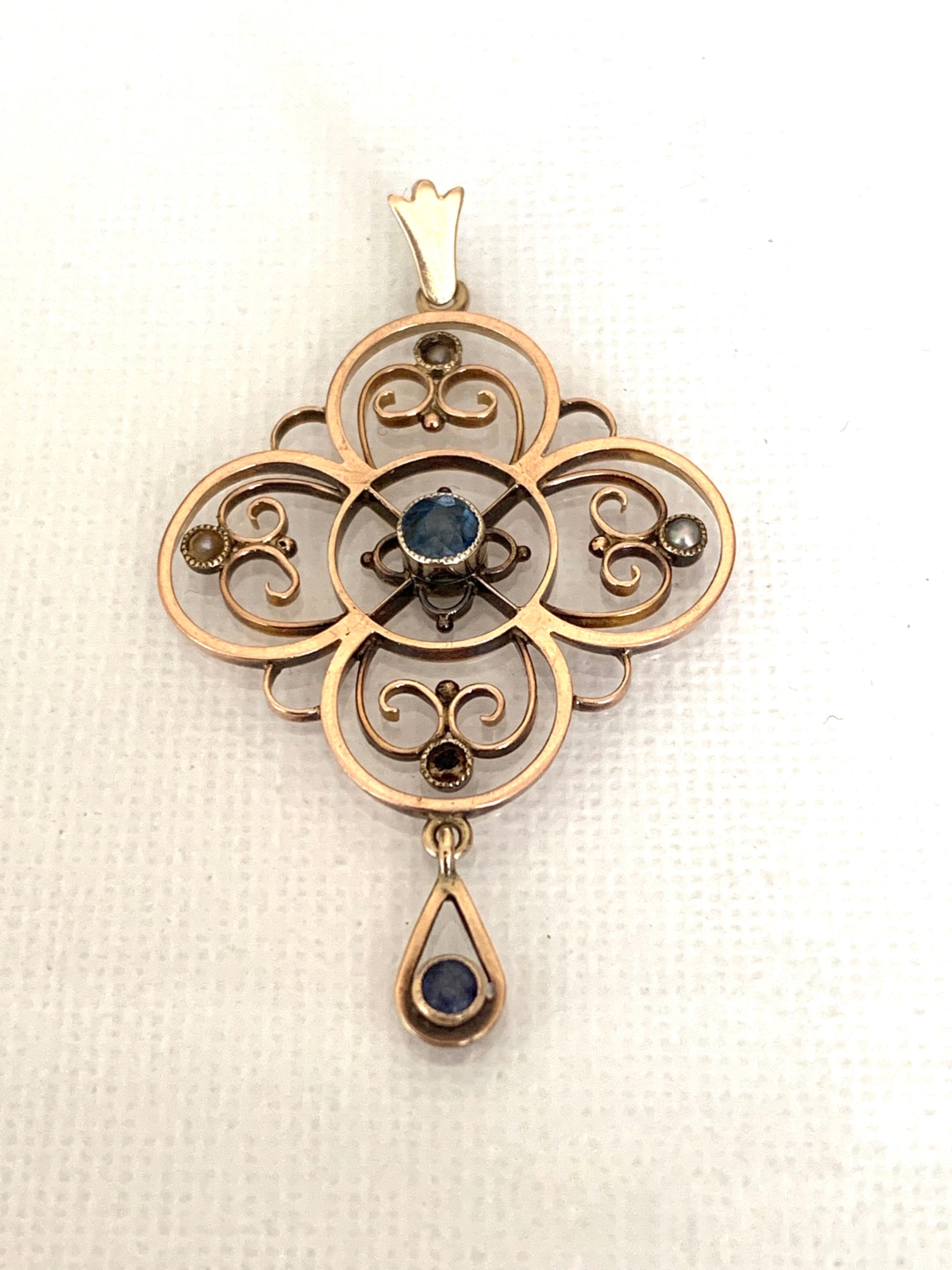 Edwardian Antique 15ct Rose Gold 
0.31 carat Sapphire Pendant .
with cultured pearls ( one missing at base of pendant )
one sapphire is 0.25 Carat Solitaire
and the other set within the swing drop is 0.06 Carat solitaire
The pendants bail is yellow