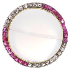 Edwardian 15kt gold and platinum moonstone brooch with rubies and diamonds 