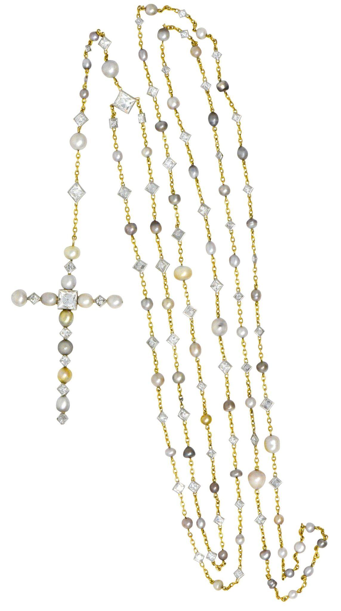 Designed as a rosary with stations, a drop and terminating in a cross

Cross centering a French cut diamond weighing approximately 1.80 carats, and set with natural pearls and smaller French cut diamonds

Necklace with natural pearls and French cut