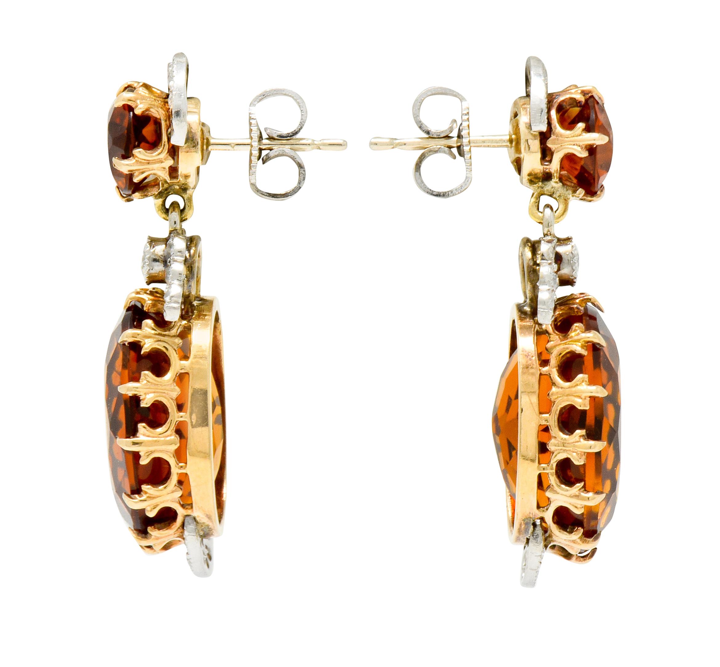 Earrings designed with a round cut Maderia citrine surmount suspending an articulated drop comprised of an oval cut Maderia citrine

Claw set in polished gold by stylized foliate prongs with total citrine weight approximately 17.26 carats;