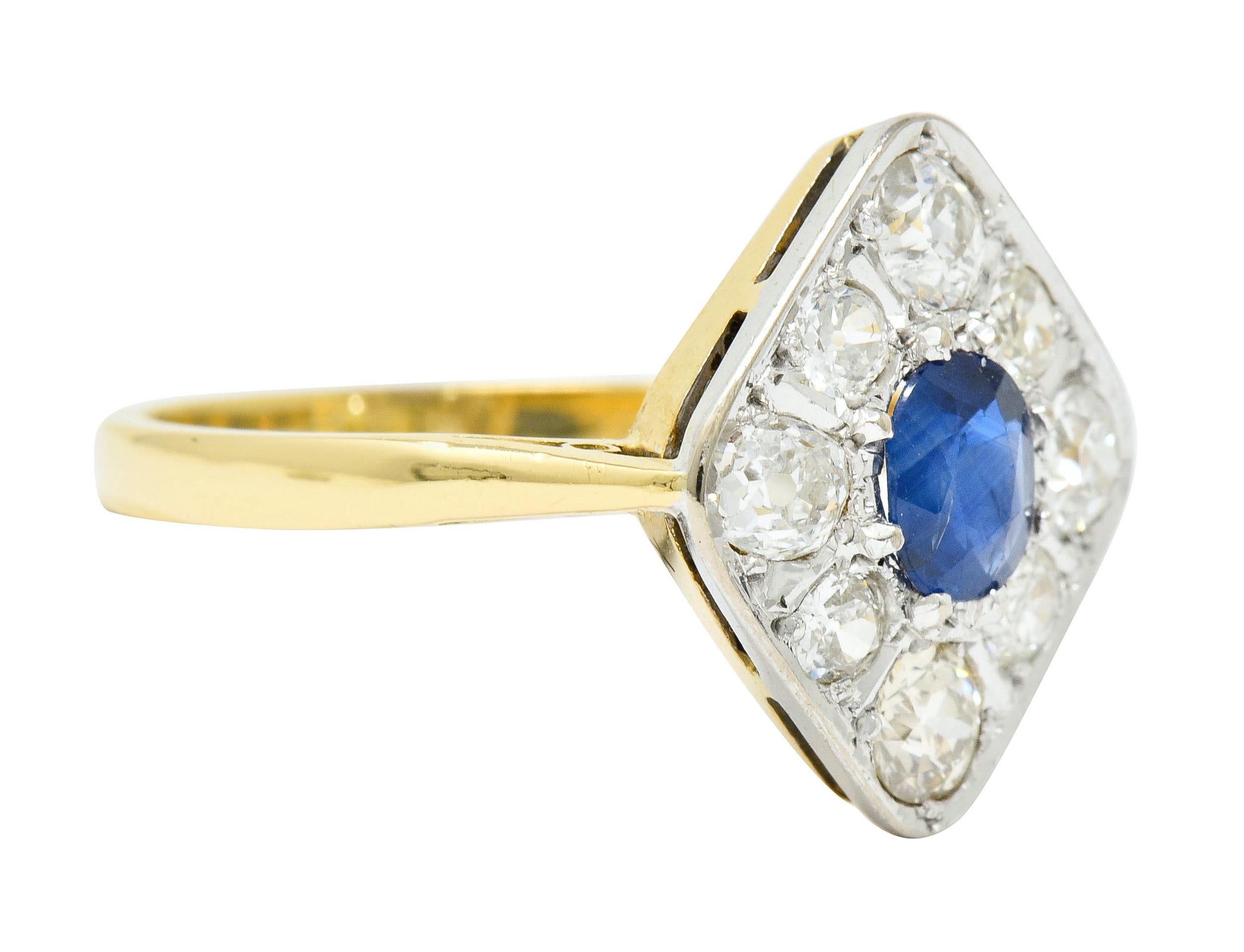 Navette shaped cluster dinner ring centering an oval cushion cut sapphire weighing approximately 0.45 carat, bright Prussian blue in color

Surrounded by old mine and old European cut diamonds weighing approximately 1.32 carats total, G to J color