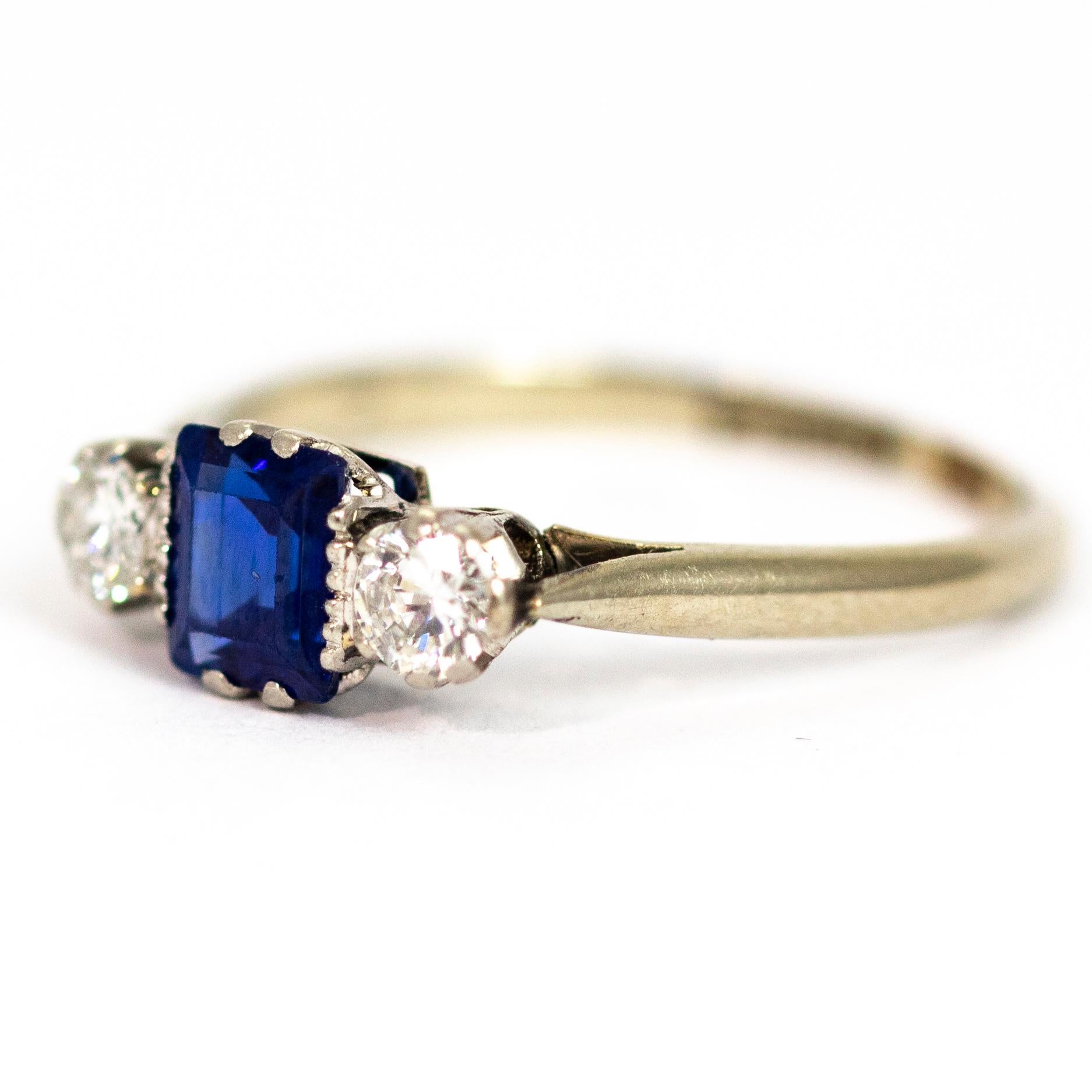 A superb three-stone ring from the Edwardian era, circa 1910. Set with a beautiful blue sapphire flanked by old European cut white diamonds measuring approximately 10 points each. Modelled in 18 carat white gold and platinum:

Ring Size: UK M 1/2,