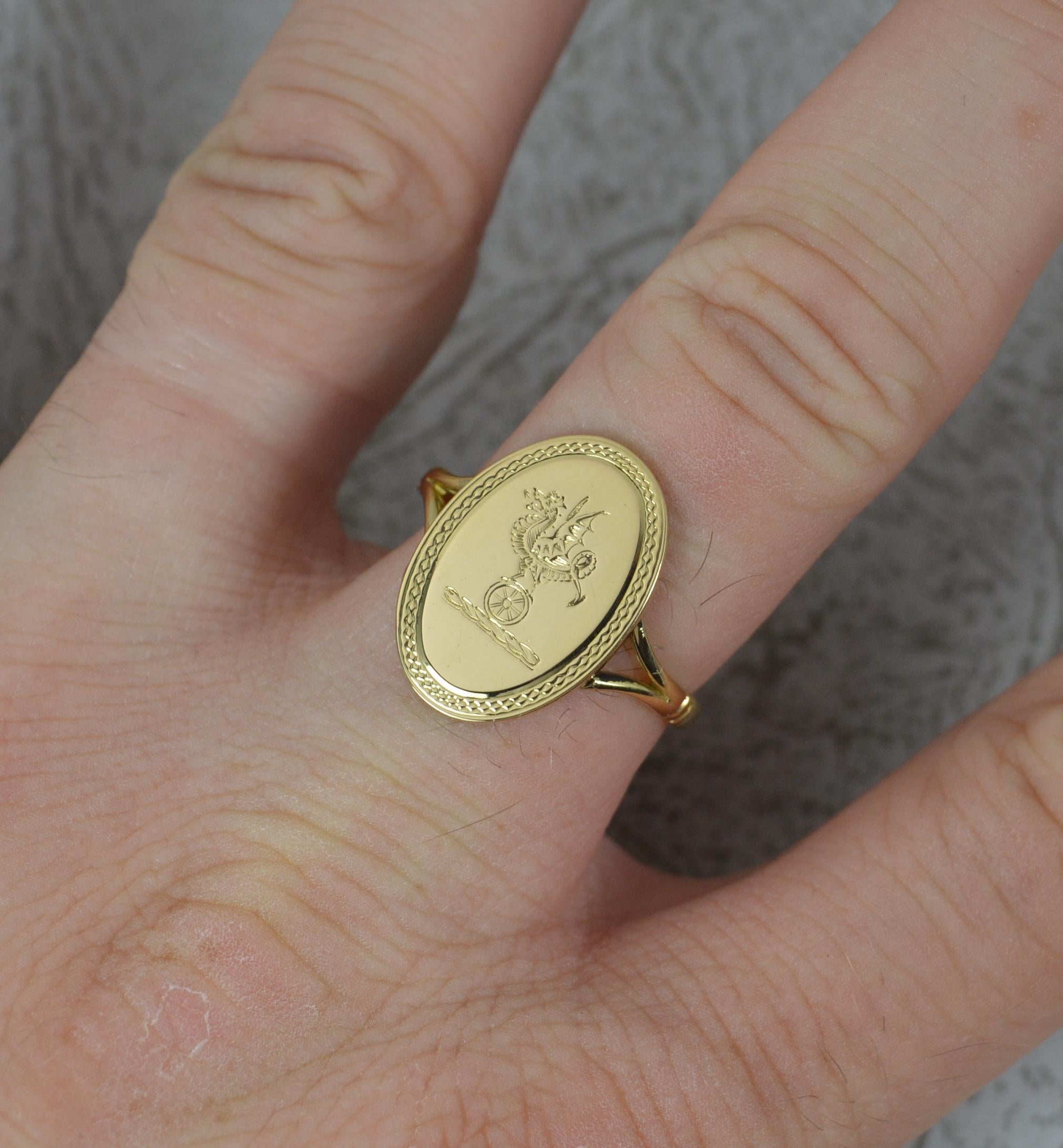 A superb antique signet ring, circa 1909.
Solid 18 carat yellow gold example.
The oval signet head to measure 12mm x 18mm. Engraved with a dragon finely balanced standing on wheel.
Split should shank.
CONDITION ; Very good. Clean and polished band.