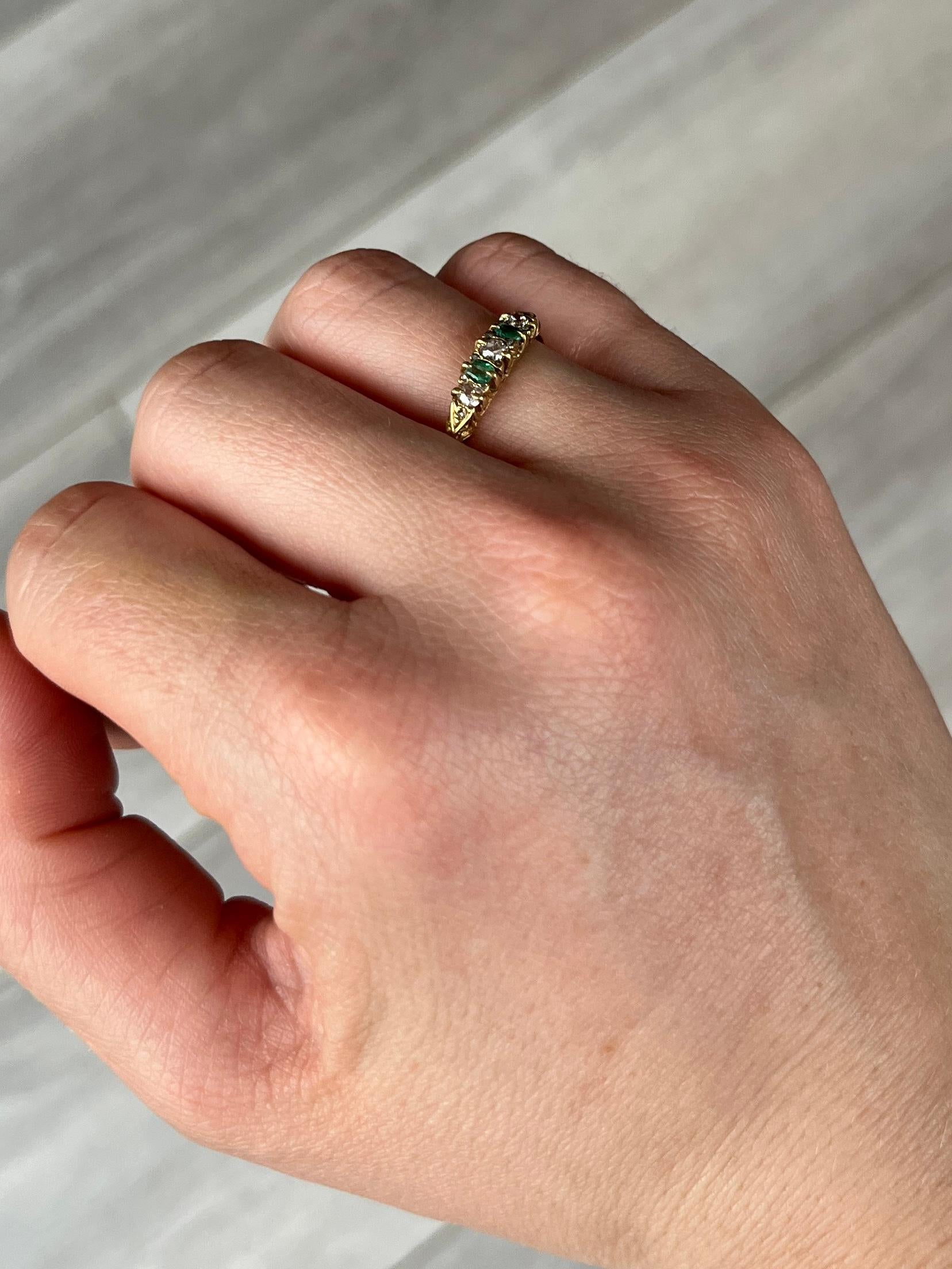 A lovely Edwardian 18 carat gold ring. Emerald total 14pts and diamond total 20pts. 

Ring Size: L or 5 3/4 
Widest Point: 4mm
Height Off Finger: 3.5mm

Weight: 2g

