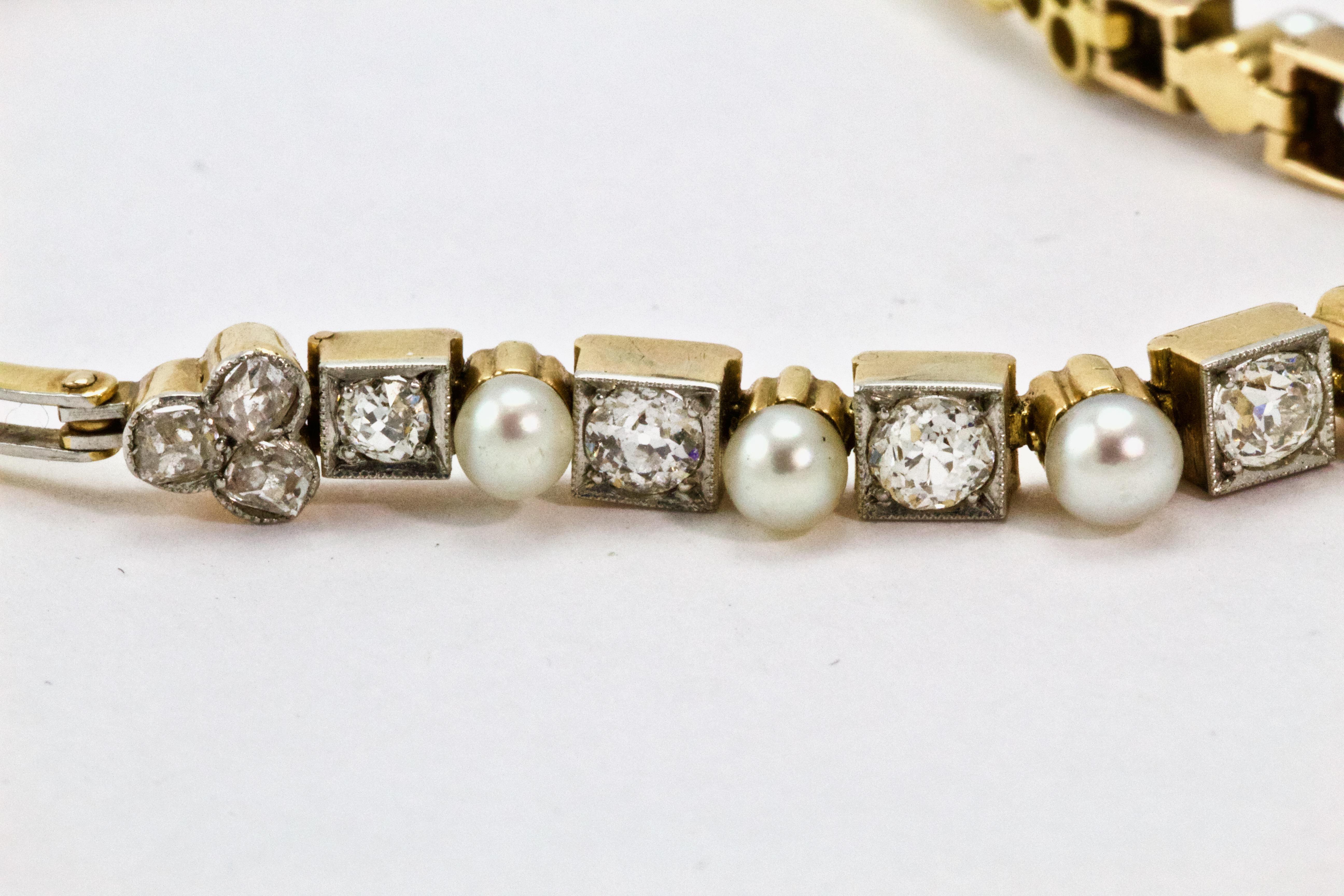 This stunning Edwardian bracelet features eight graduated old European cut diamonds alternated with seven natural pearls and a tefoil of rose cut diamonds to either end. The bracelet is modeled in 18k yellow gold, whilst each diamond sits in a