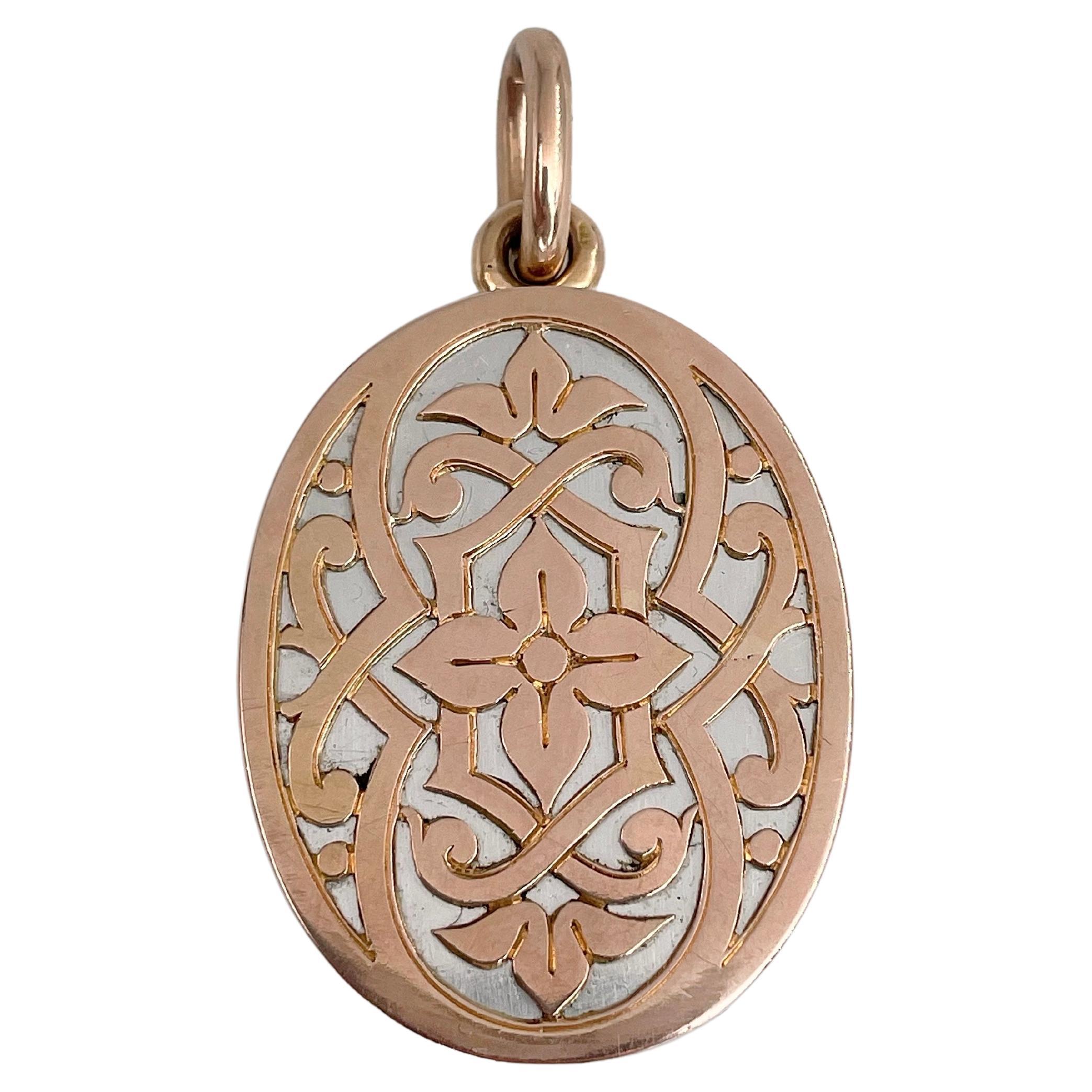 Edwardian 18 Karat Bi-Colour Gold Arabesque Ornament Oval Locket Pendant For Sale