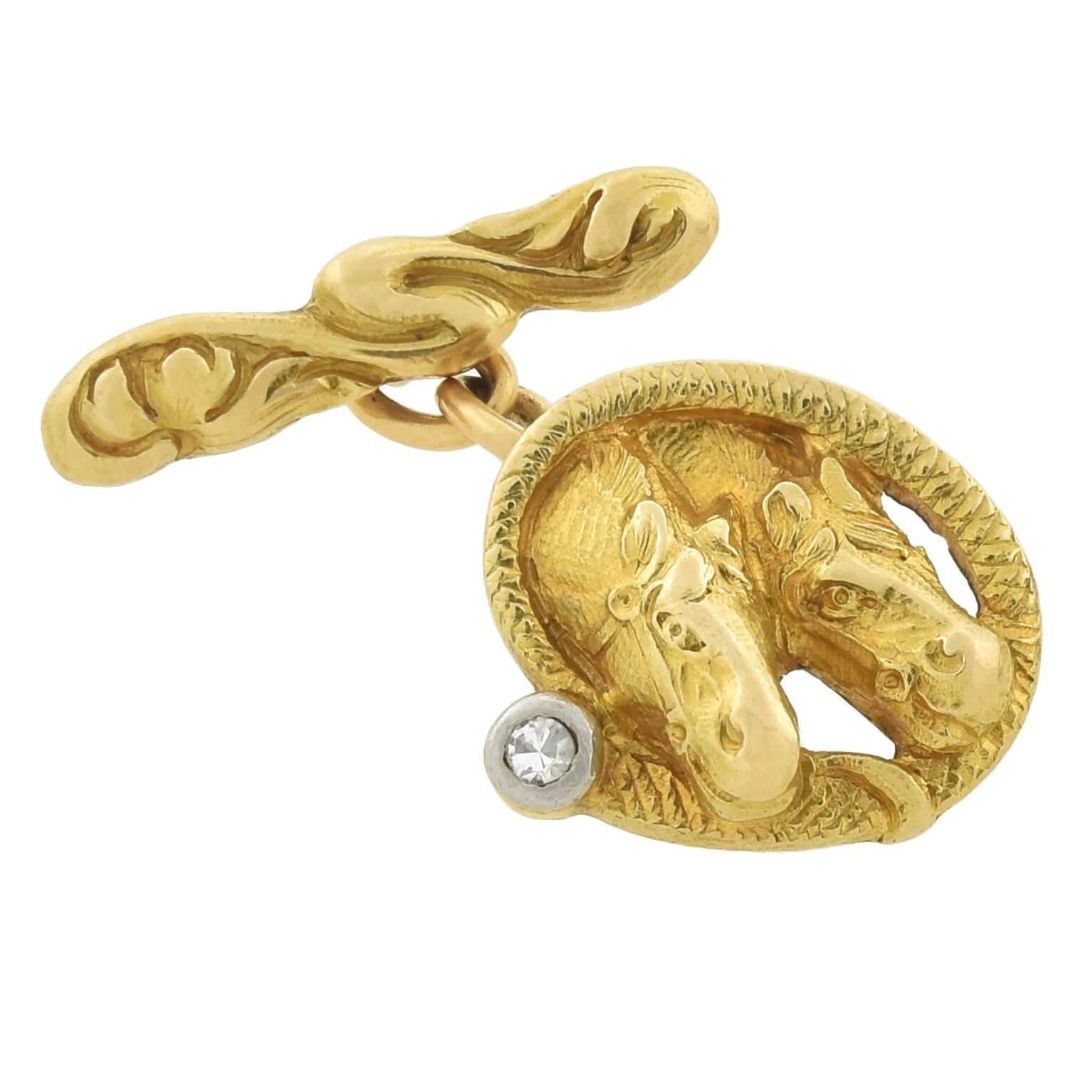 A fantastic and unique pair of equestrian-inspired cufflinks from the Edwardian (ca1910) era! Crafted in vibrant 18kt yellow gold with platinum accents, each cufflink displays a raised repousse design depicting two animated racing horses. The front