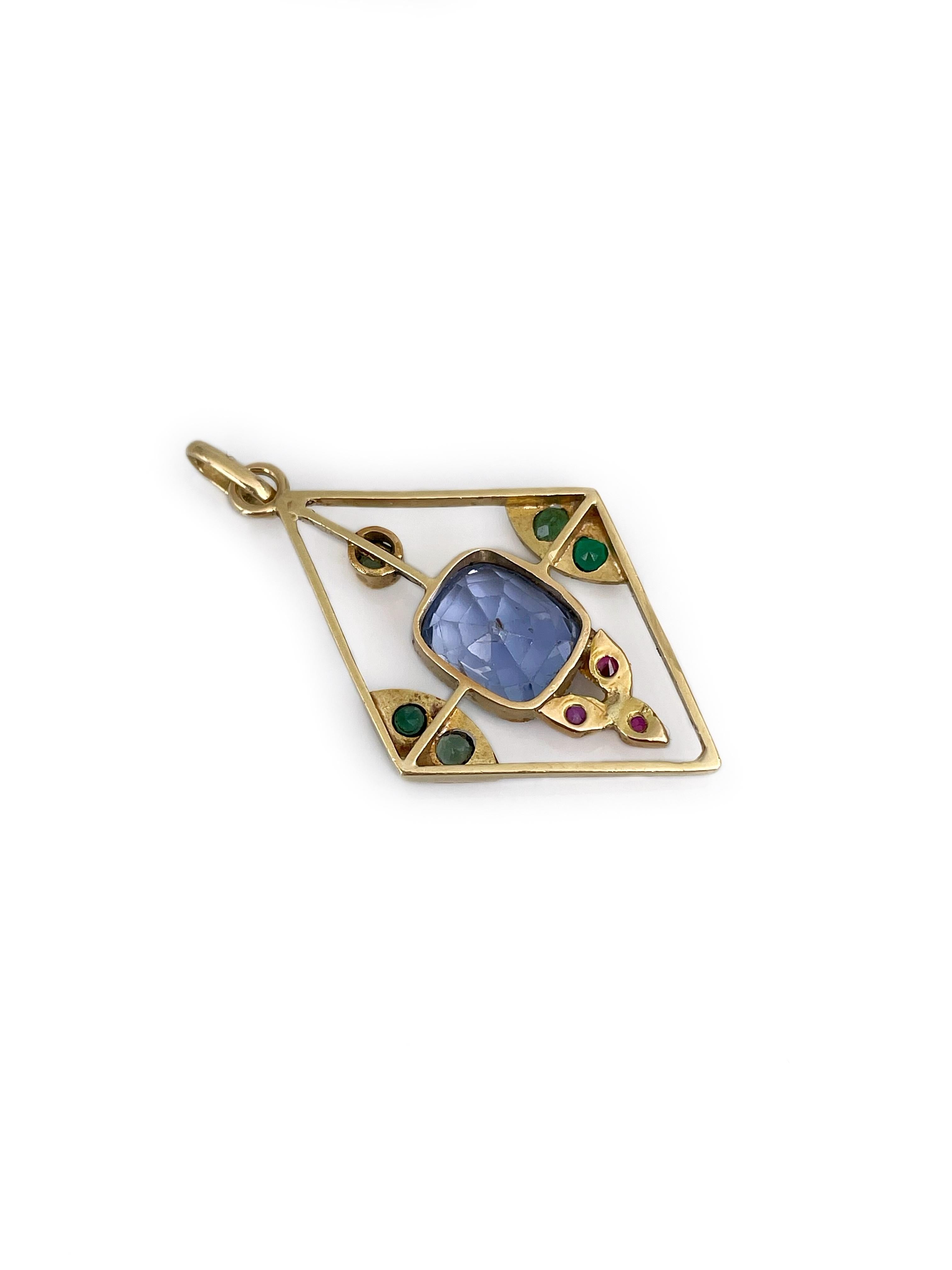 It is a lovely Edwardian rhombus pendant necklace crafted in 18K yellow gold. Sapphire’s mount - 14K gold. 
The piece features: 
- 1 sapphire: cushion cut, 2.35ct, vB 3/3, SI
- 3 rubies: round cut, 0.06ct, rO 3/1, VS
- 5 emeralds: round and oval