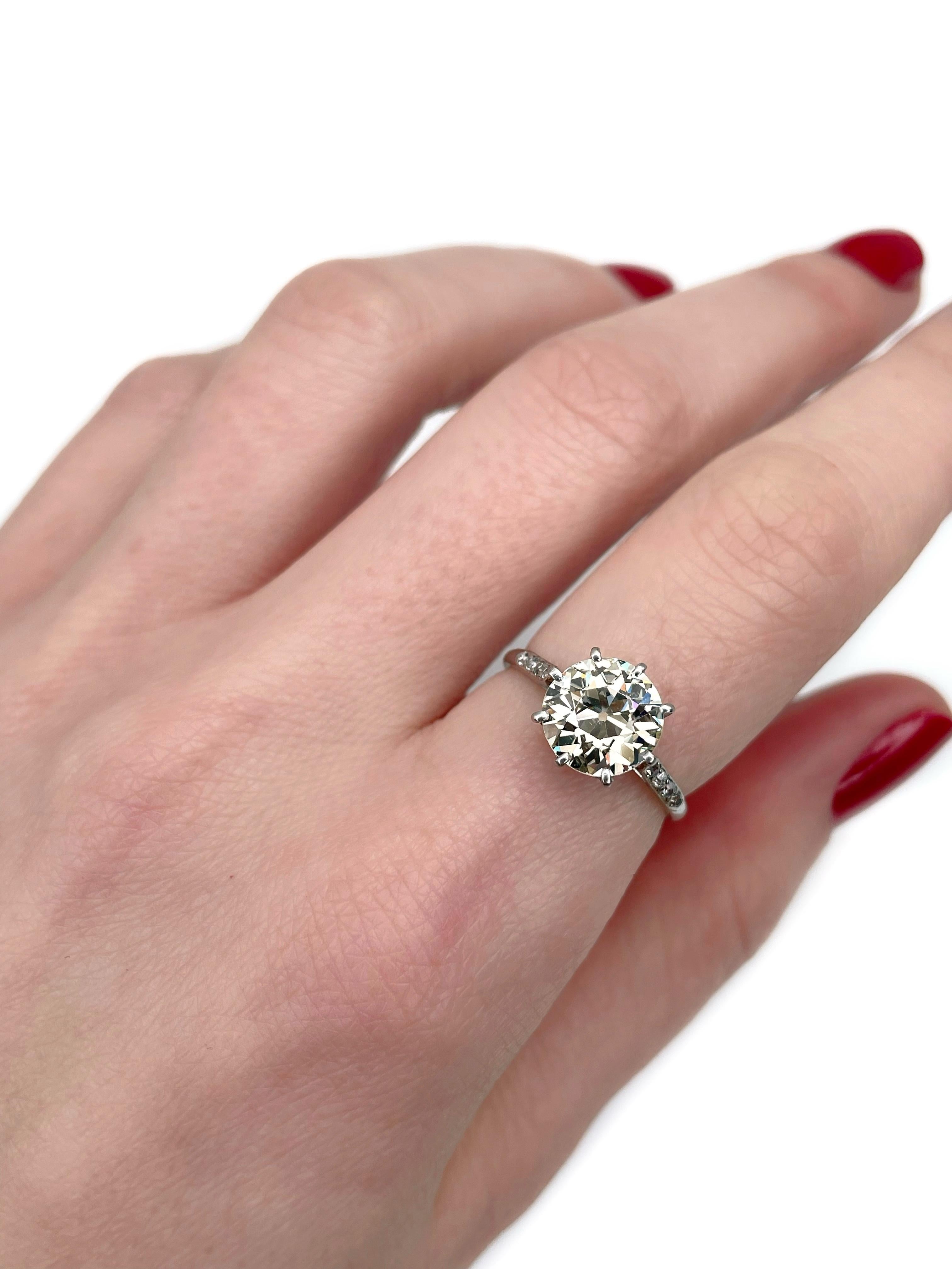 This is a magnificent solitaire engagement ring crafted in 950 platinum. Circa 1910. 

The piece is tested by the Assay Office. It features:
- 1 diamond, old European cut, 2.70ct, TW, VS.
- 8 diamonds, old cut, TW 0.07ct, RW-W, VS-SI.

Hard to show
