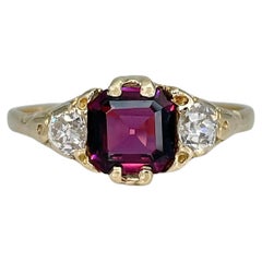 Edwardian 18 Karat Gold Garnet Rhodolite 0.38 Carat Diamond Three-Stone Ring