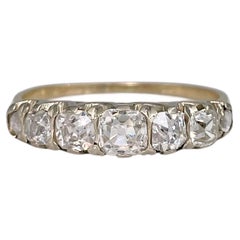 Edwardian 18 Karat Gold TW 1.04 Carat Old Cut Diamond Seven-Stone Band Ring