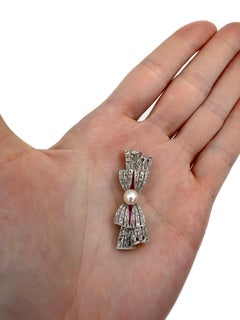 Edwardian 18 Karat Gold Pearl Rose Cut Diamond Ruby Bow Pin Brooch