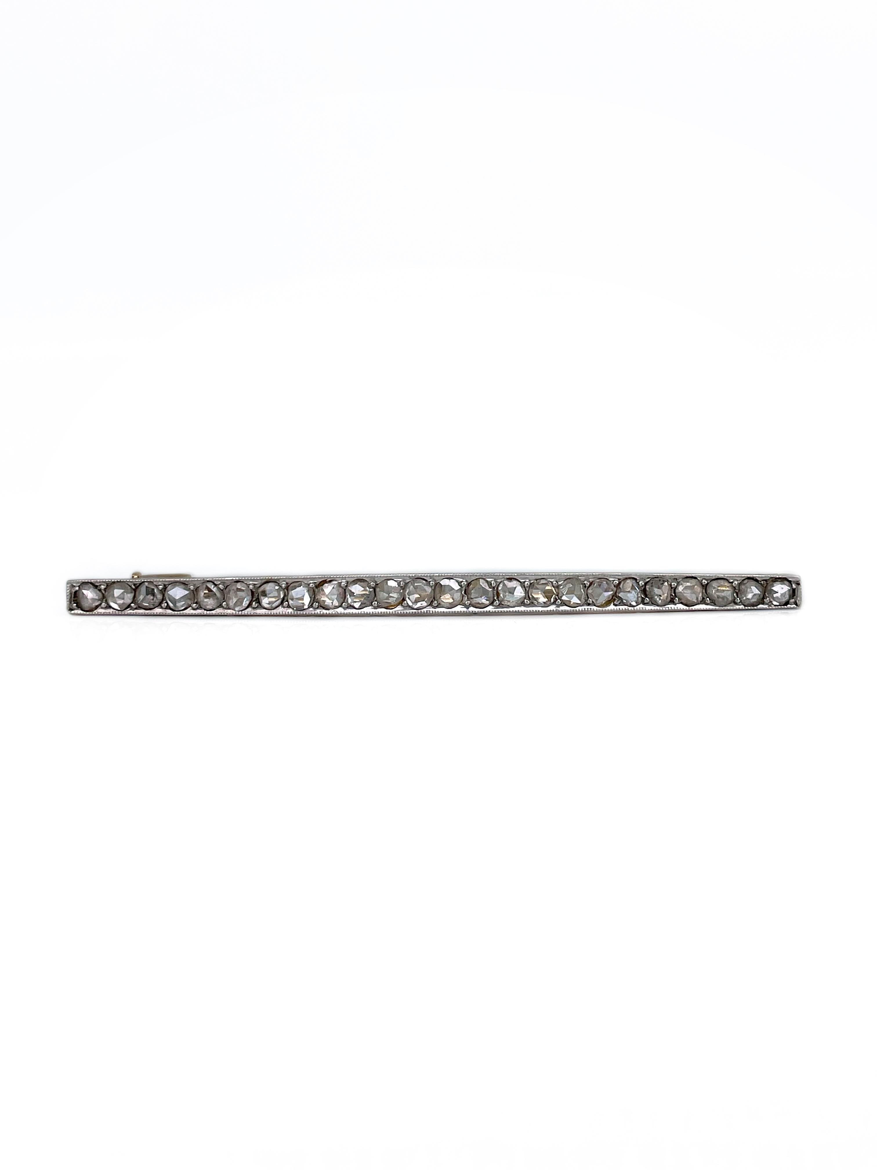 This is an Edwardian bar brooch crafted in 18K gold and 850 platinum. Circa 1910. 

The piece features 24 diamonds: rose cut, TW 1.10ct, RW-STW, VS-SI.

Has a trombone clasp. 

Weight: 3.54g
Length: 5.6cm

IMPORTANT: As a buyer, you are fully