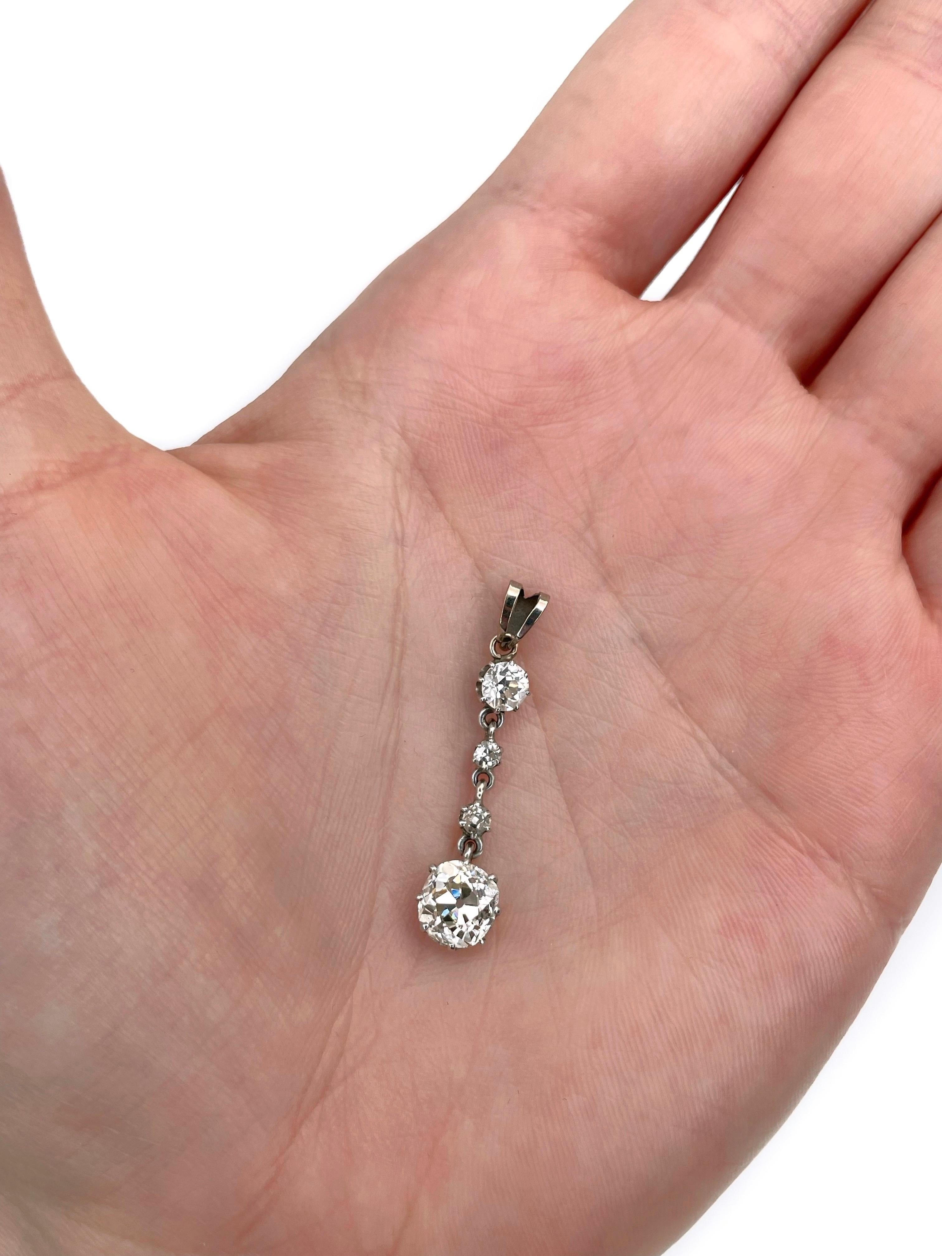 This is an Edwardian drop pendant crafted in 18K gold. Circa 1920. 

The piece features diamonds. The biggest is old mine cut: ~1.50ct, VS1. The rest 3 diamonds are old European cut (TW ~0.30ct).  

Weight: 1.71g
Length: 3.5cm

IMPORTANT: As a
