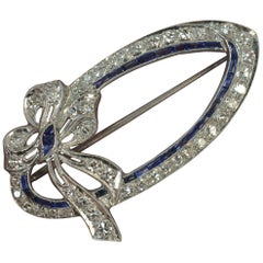 Edwardian 18 Karat White Gold Sapphire 1.00 Carat Diamond Bow Brooch