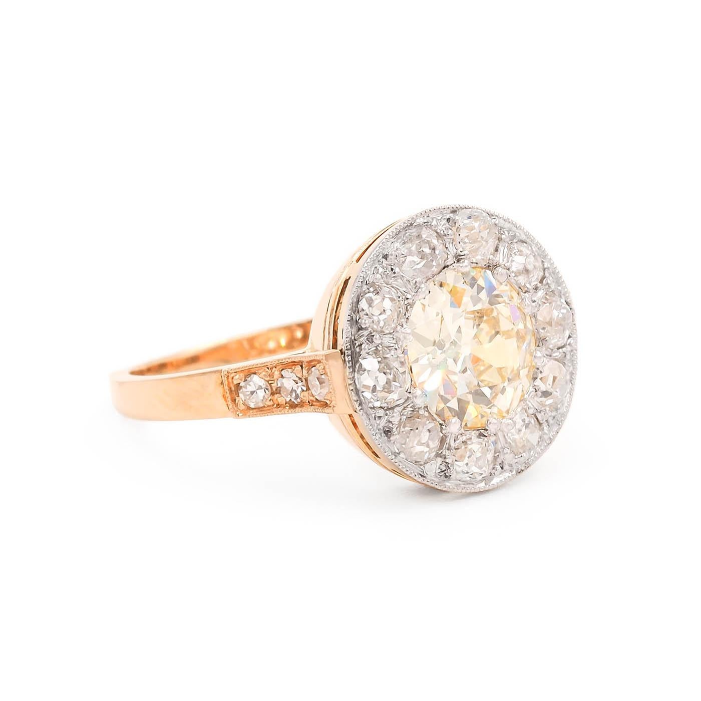 French Edwardian era 1.83 Carat Old European Cut Diamond Cluster Engagement Ring composed of 18k yellow gold and platinum. With a 1.83 carat Old European Cut diamond, GIA certified S-T color & VS2 clarity. The center diamond is surrounded by 10 Old