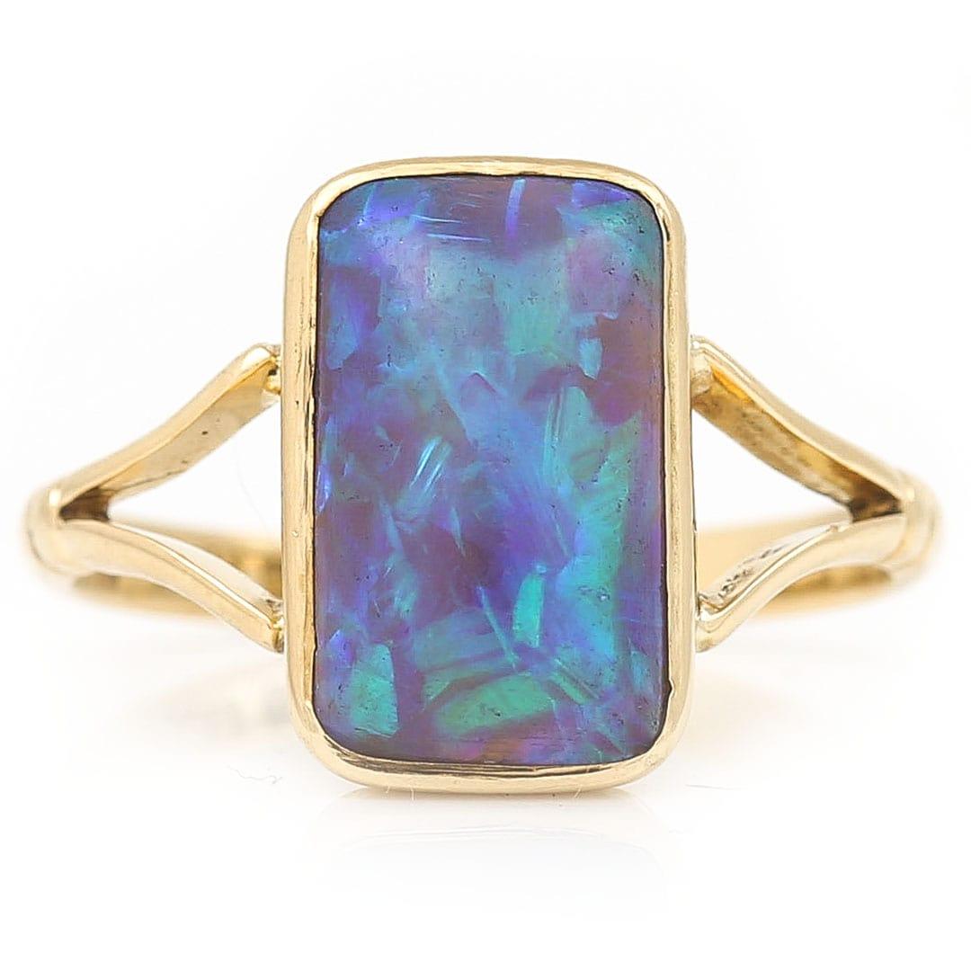 A stunning early 20th century 18ct yellow gold 3.3ct water opal single stone ring. Dating from circa 1905 this mesmerising Edwardian ring has one of the prettiest opal we’ve had the pleasure of seeing. The play of colour, with eccentric blues,