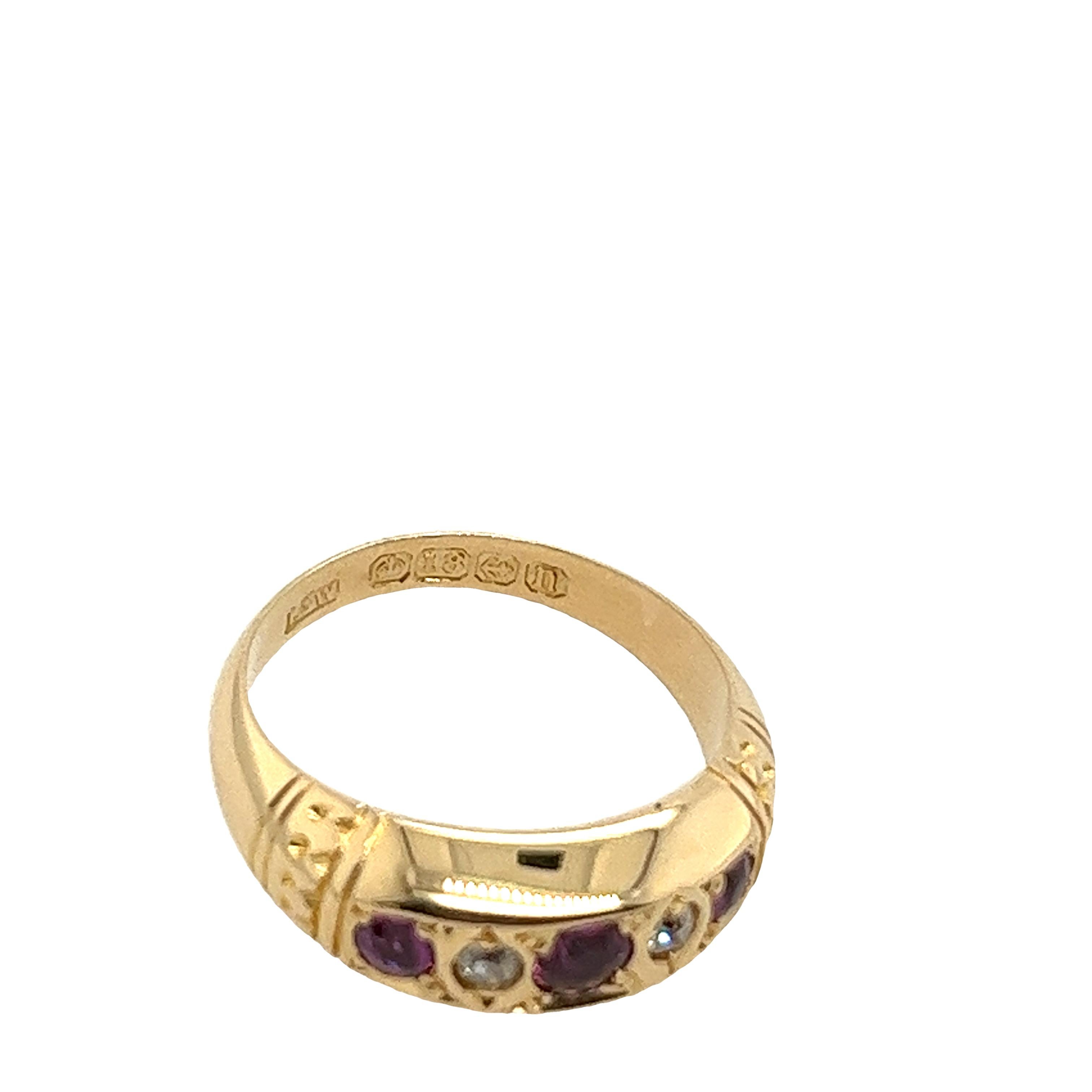 An elegant vintage 5-stone ring, set with 2 round diamonds and 3 round fine quality rubies, in an 18ct yellow gold setting.

Total Diamond Weight: 0.04ct
Diamond Colour: H-I
Diamond Clarity: I1
Width of Band: 2.95mm
Width of Head: 6.75mm
Length of