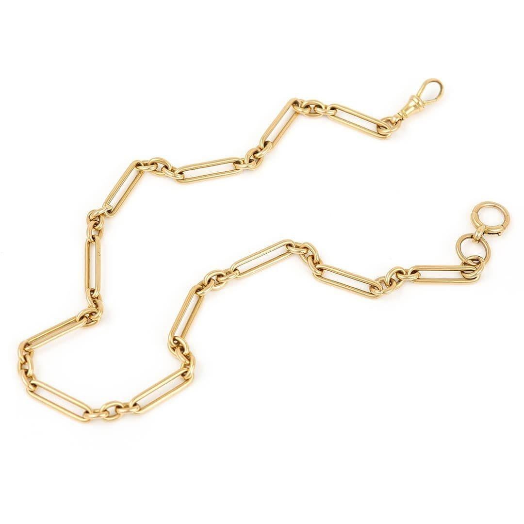 A solid, heavy 18ct yellow gold antique Edwardian Albert chain with alternating trombone & round uniform links. Every link is stamped ‘18' with the crown assay mark, a common finesse mark in England, the wheatsheaf for Chester and a lower case 'c'