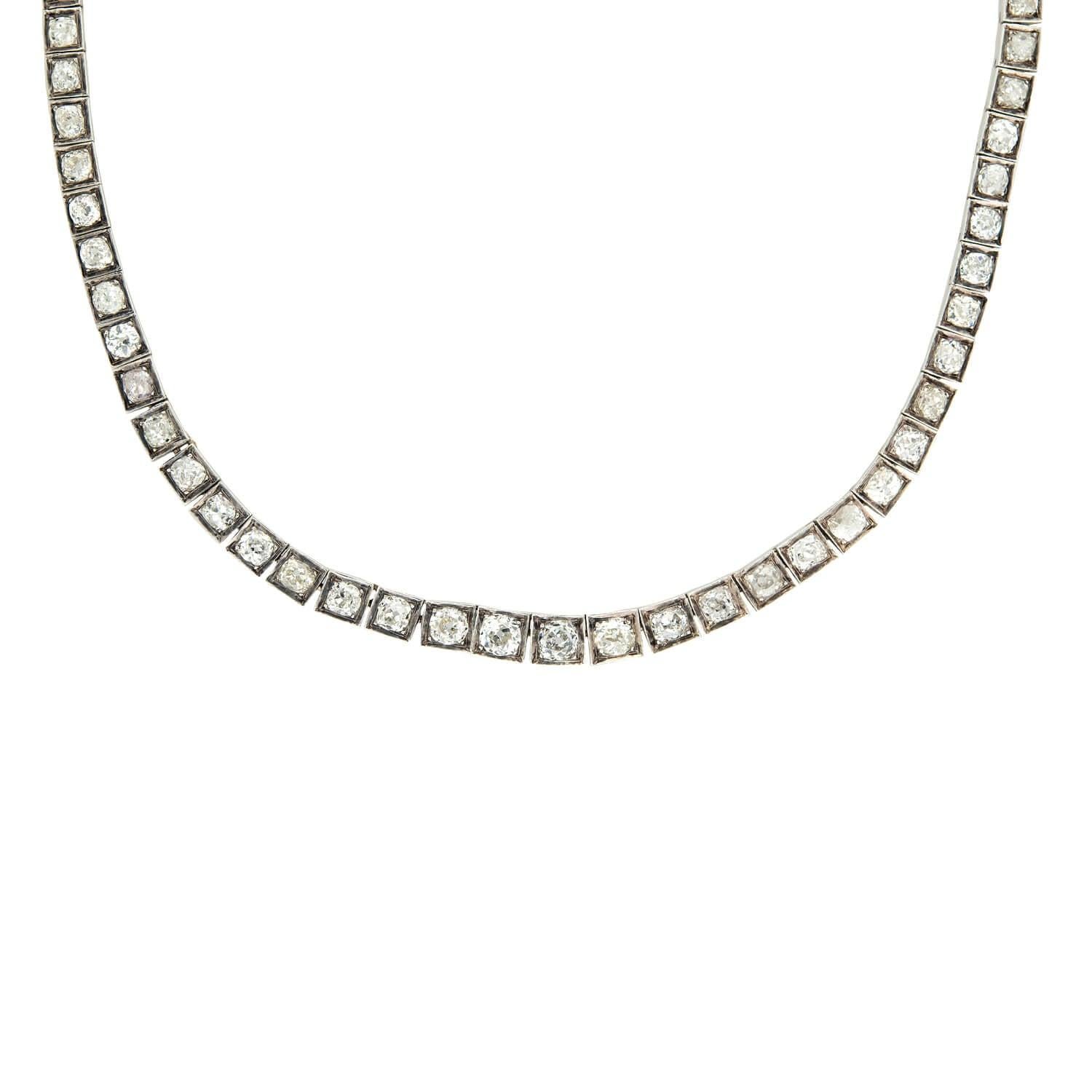 An exquisite Riviera diamond necklace from the Edwardian(ca1910) era! Made of 18k white and yellow gold, this beautiful necklace has 77 graduating old mine cut diamonds which are set within white gold box bead settings. The diamonds are hinged